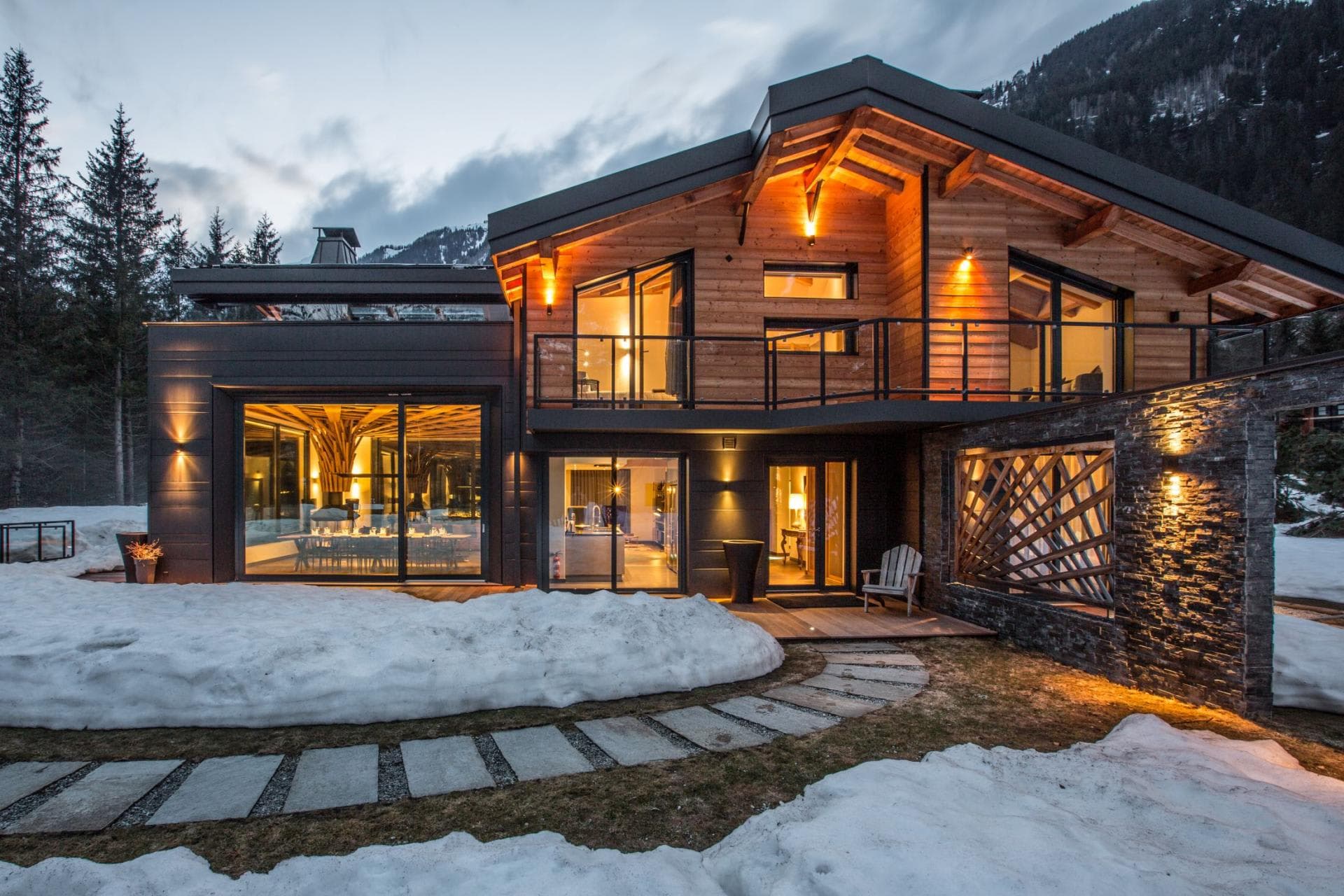 Ski-in/ski-out chalet with wrap-around balcony and stone path entry