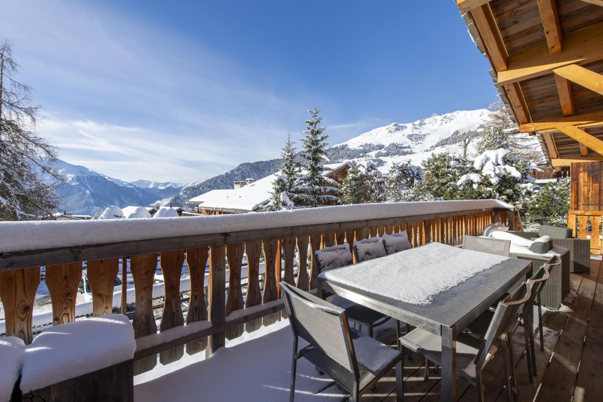 Private balcony with outdoor dining for 6 and panoramic mountain views