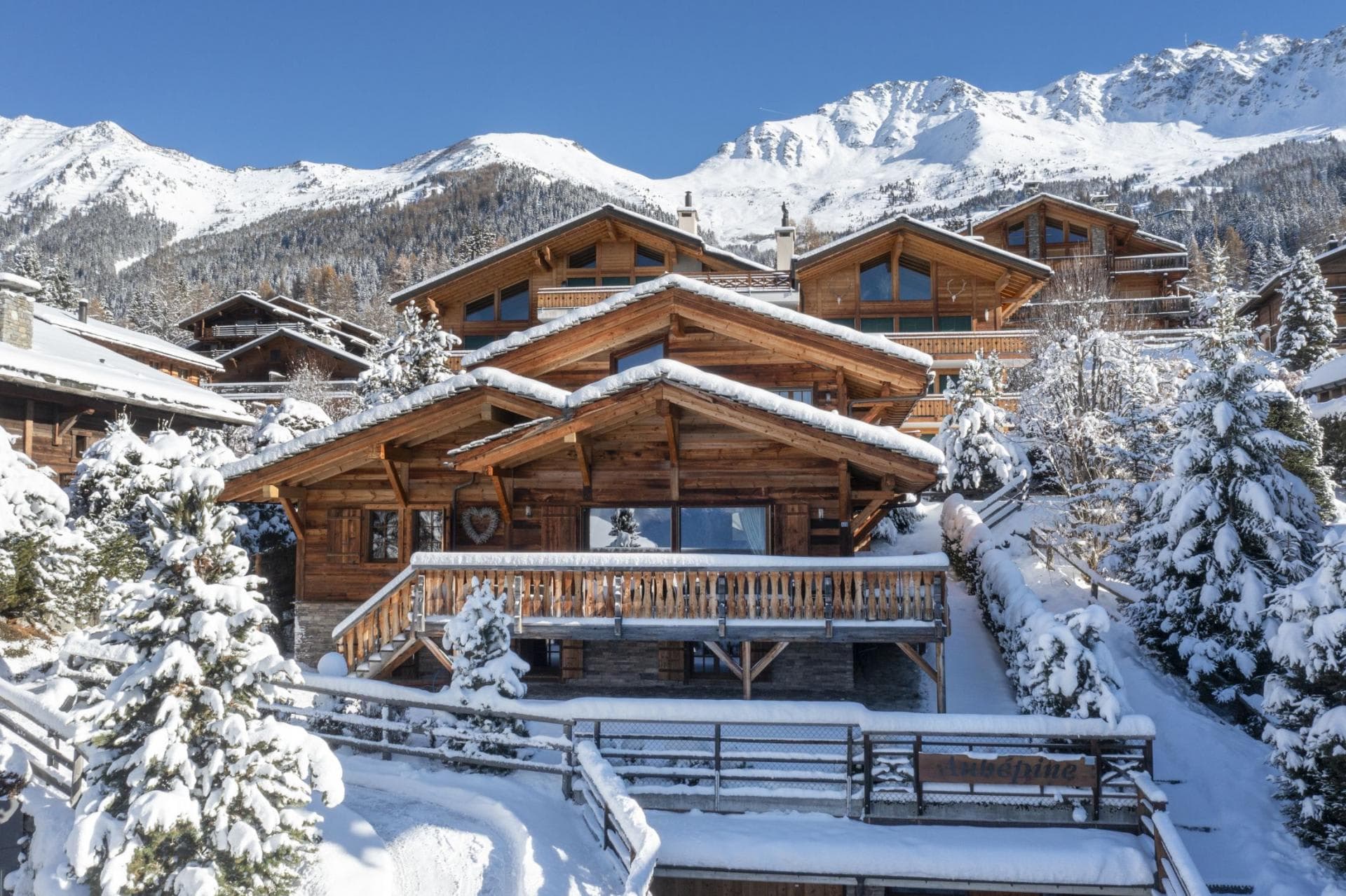 Ski-in/ski-out timber chalet with private balcony and alpine mountain views