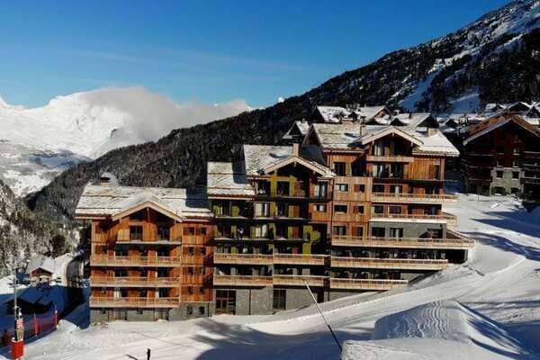 Ski-in/ski-out chalet exterior with private balconies and mountain views