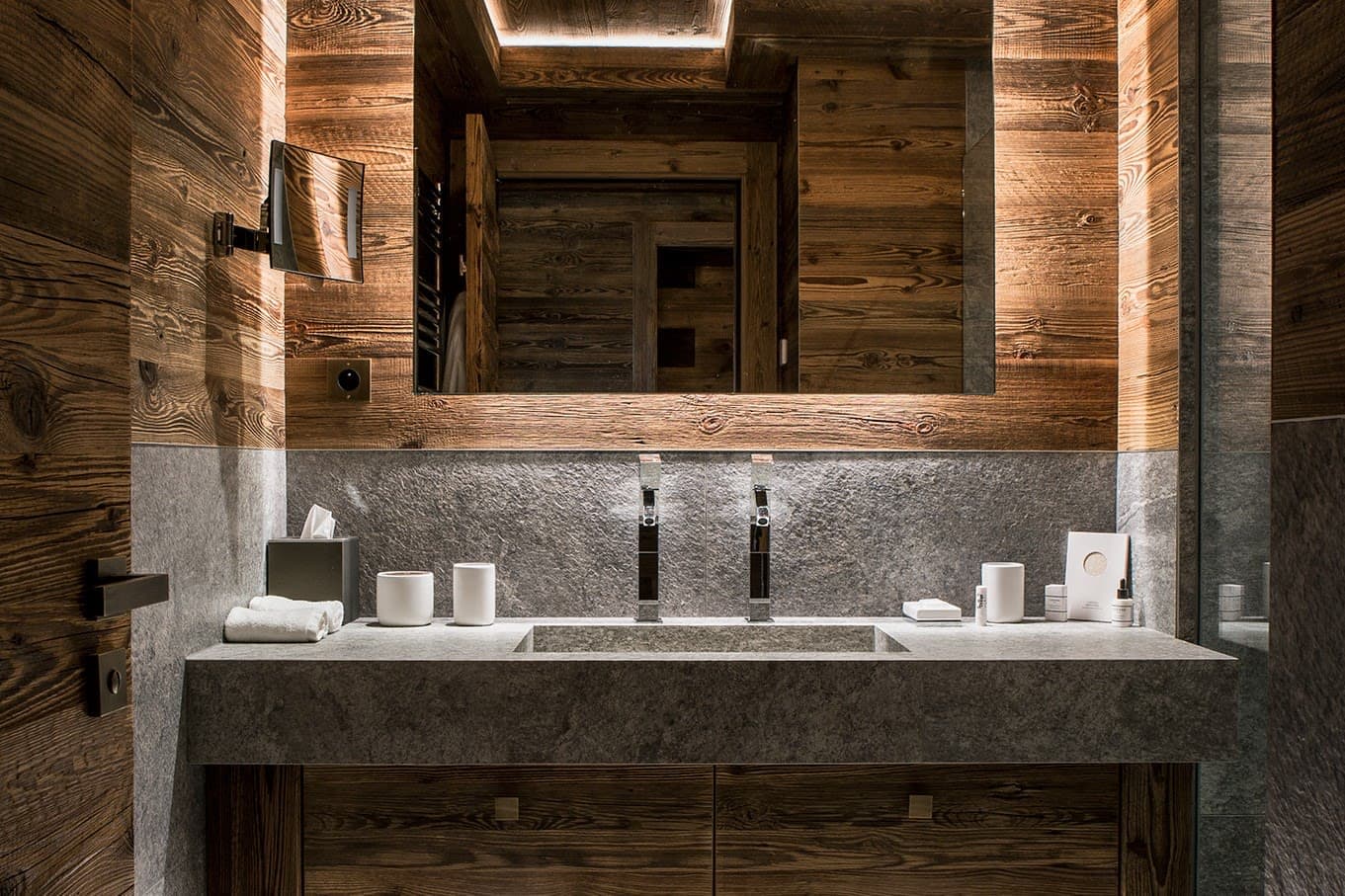 Bathroom with stone trough sink and dual faucets