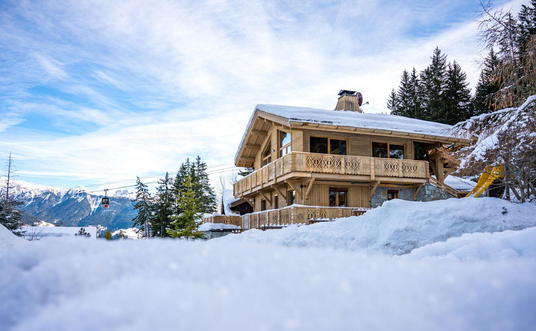 Ski-in/ski-out chalet exterior with direct access to gondola and mountain views