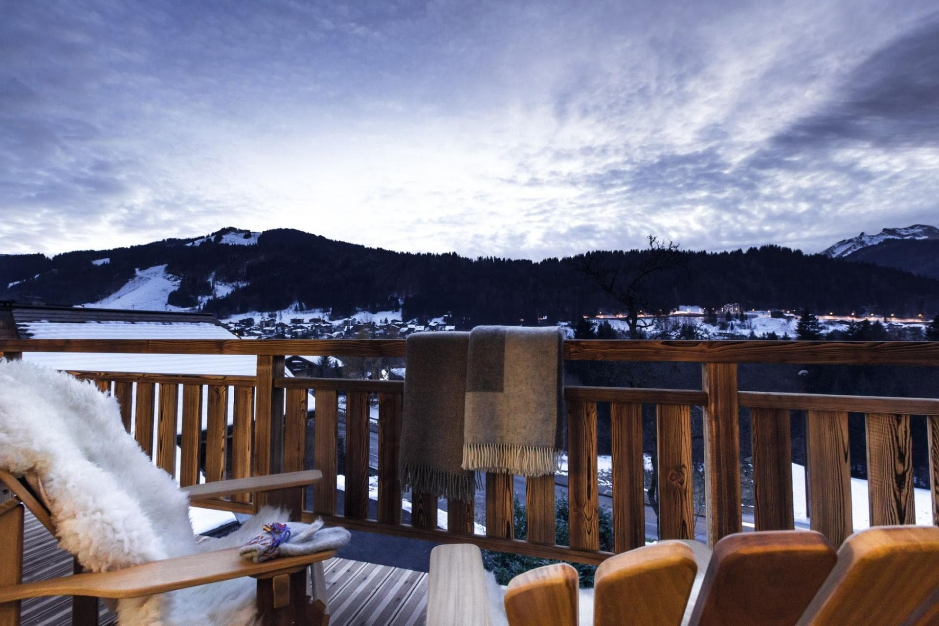 Private balcony with mountain views and Adirondack seating