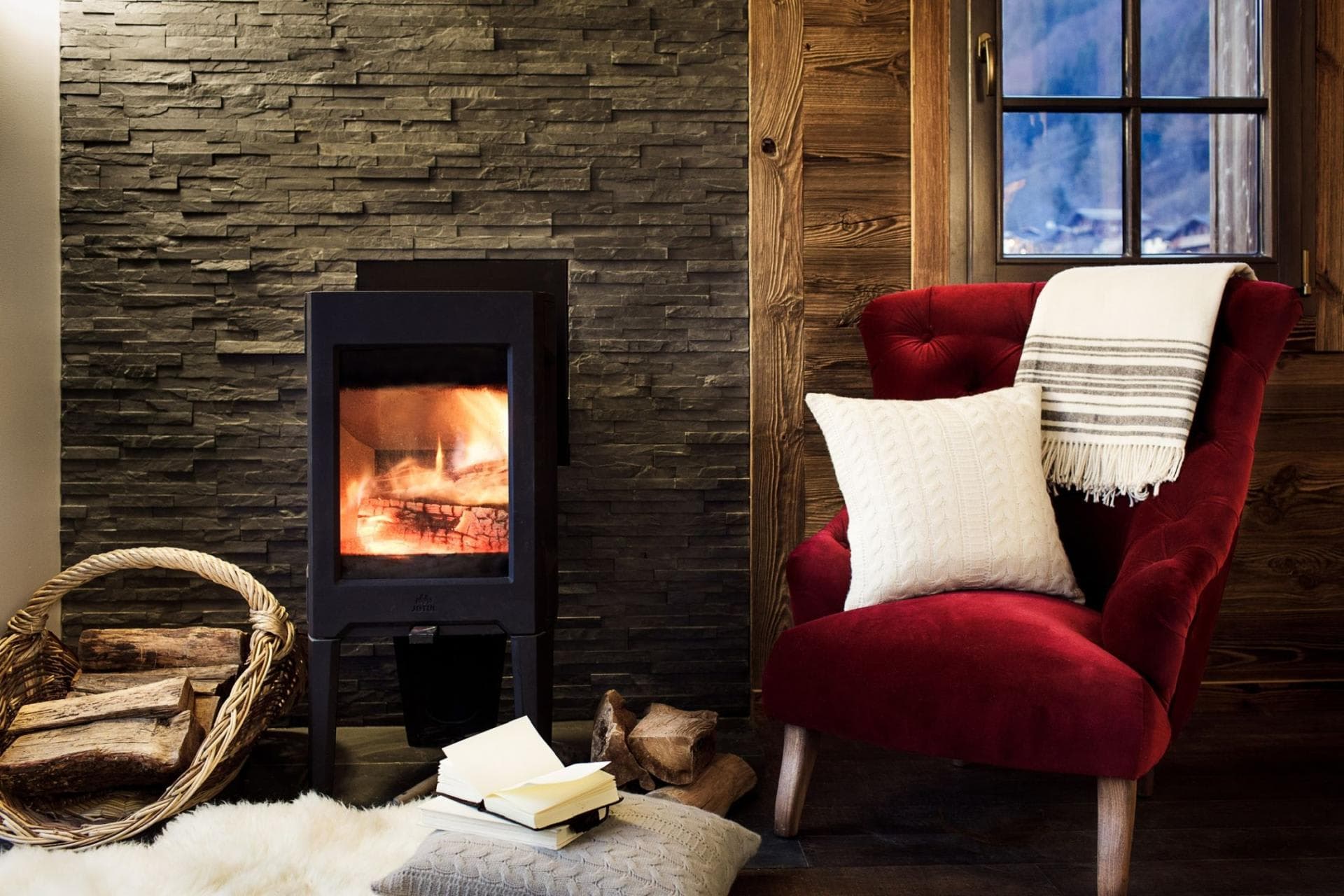 Wood-burning stove with stacked stone surround and mountain views