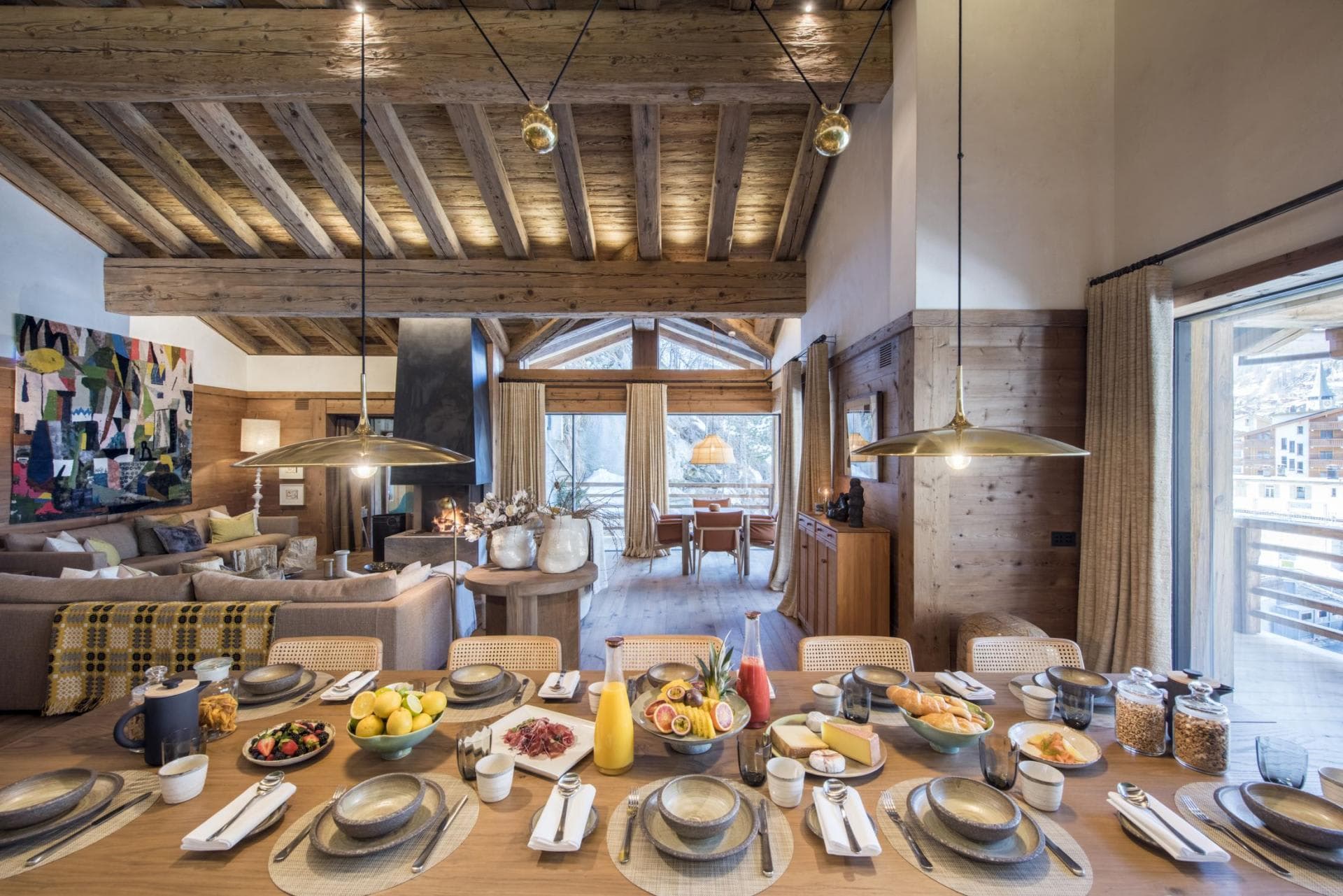 Open-plan layout with vaulted timber ceilings, dining for 10, and fireplace