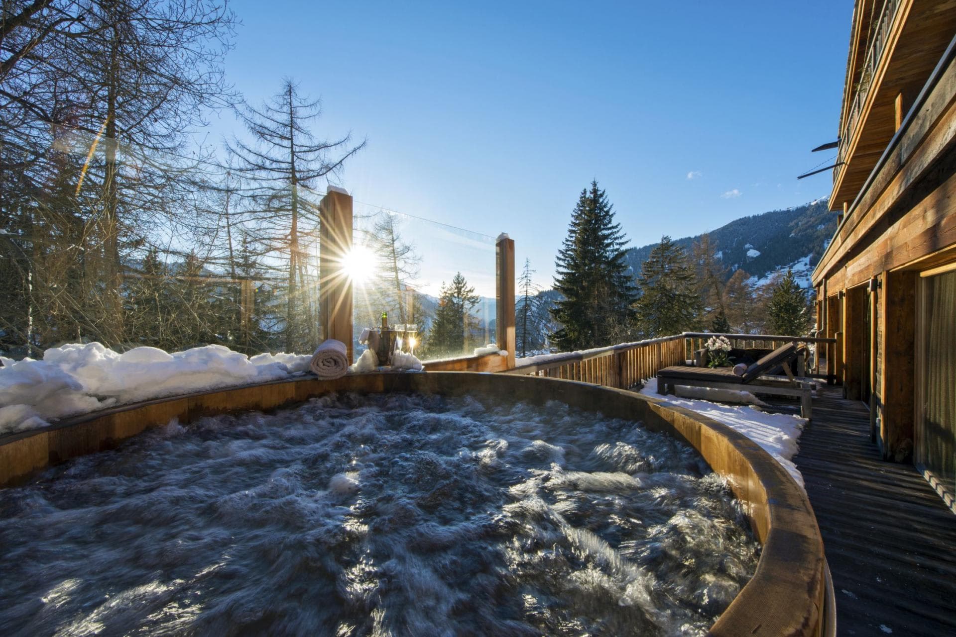 Cedar hot tub on private deck with mountain and valley views