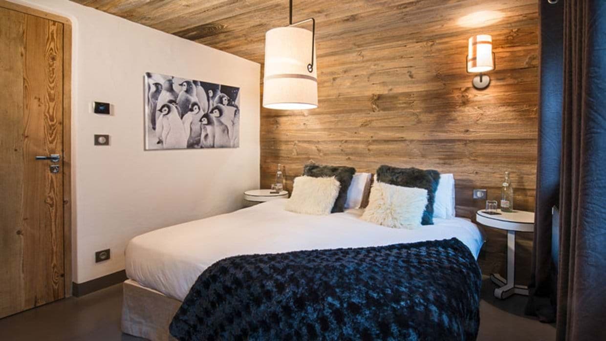 Guest bedroom with king bed and reclaimed wood accent walls