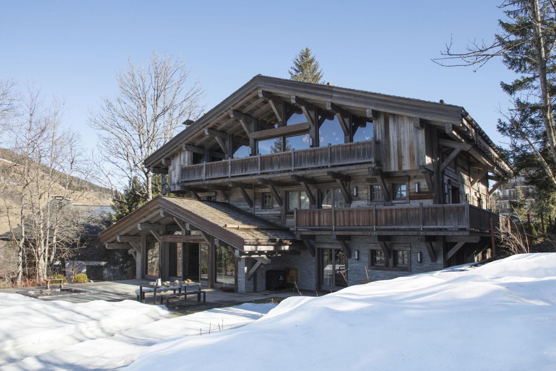 Ski-in chalet with wrap-around balconies and ground-floor terrace seating