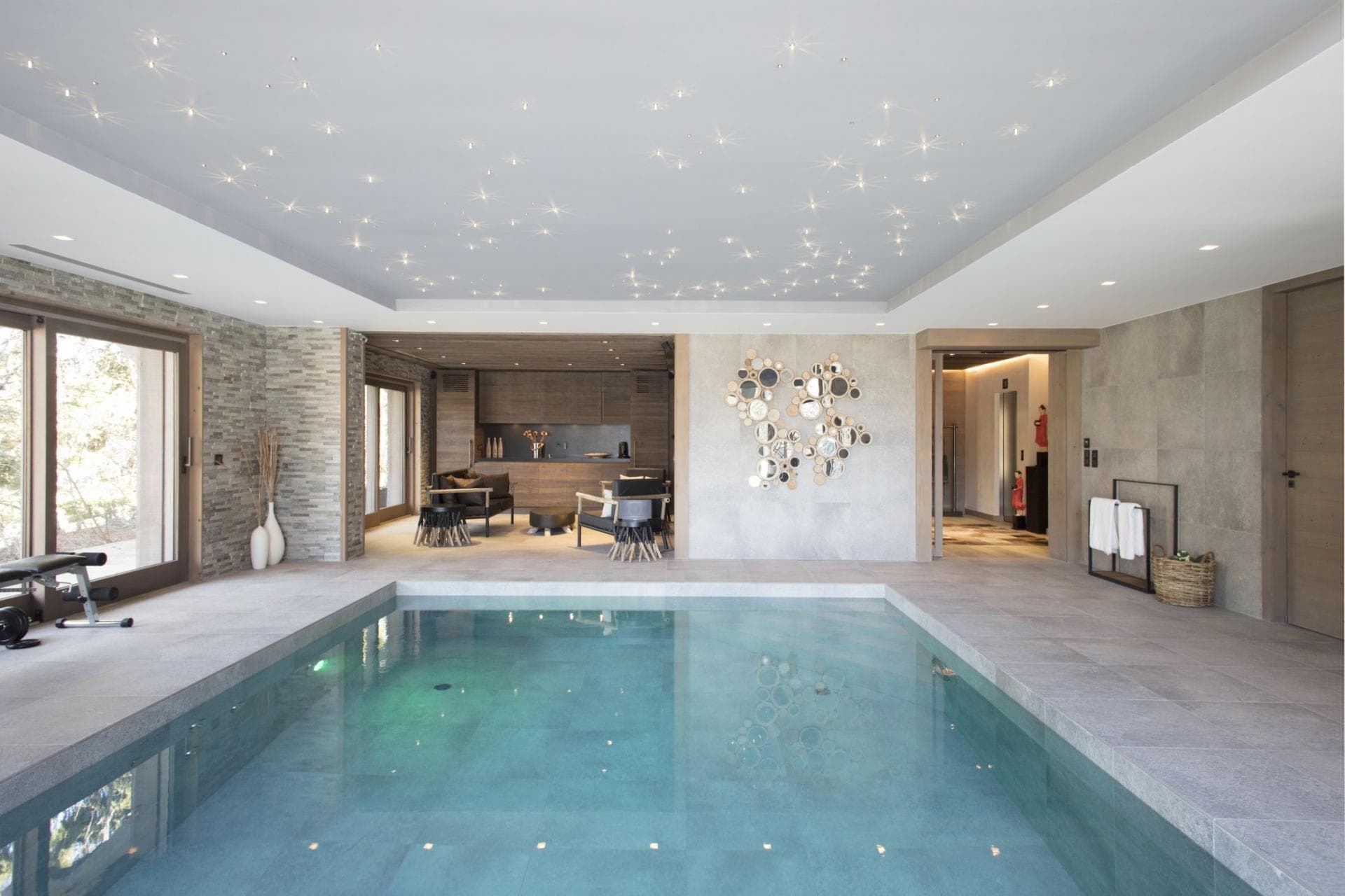 Indoor pool with fiber optic star ceiling and adjacent lounge area