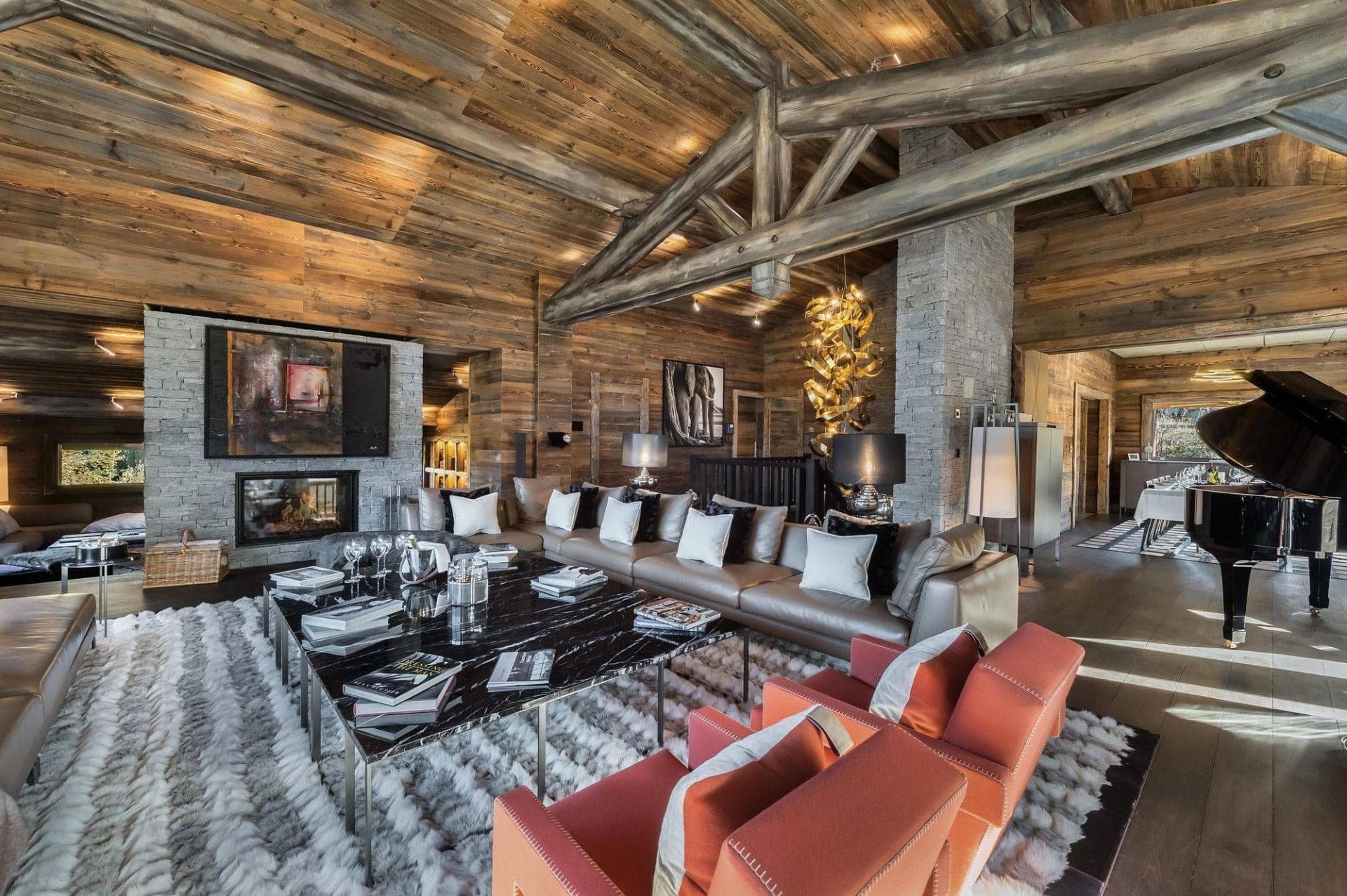Living area with wood-beamed ceilings, fireplace, and grand piano