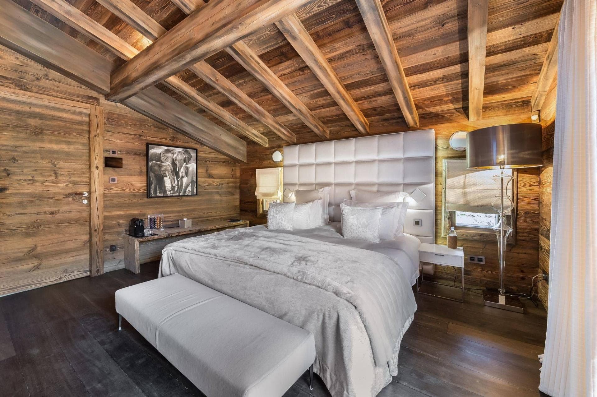 Primary bedroom with king bed and reclaimed wood walls and ceiling