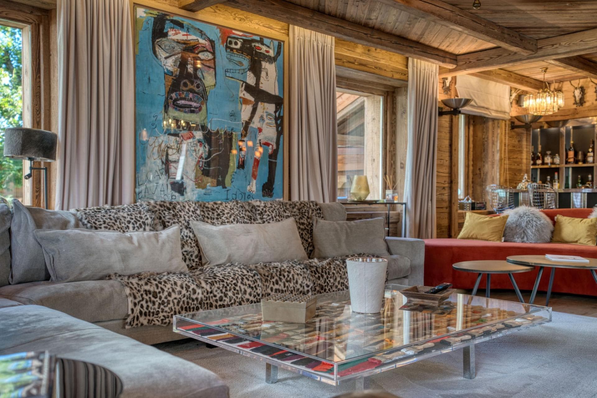 Living area with sofa seating and bar area in background