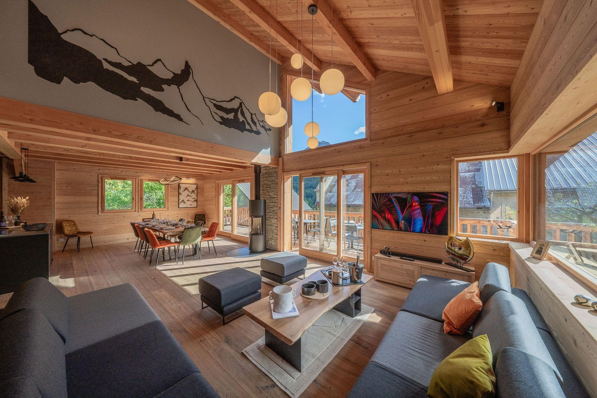 Open-plan living area with wood-burning stove and dining for 8