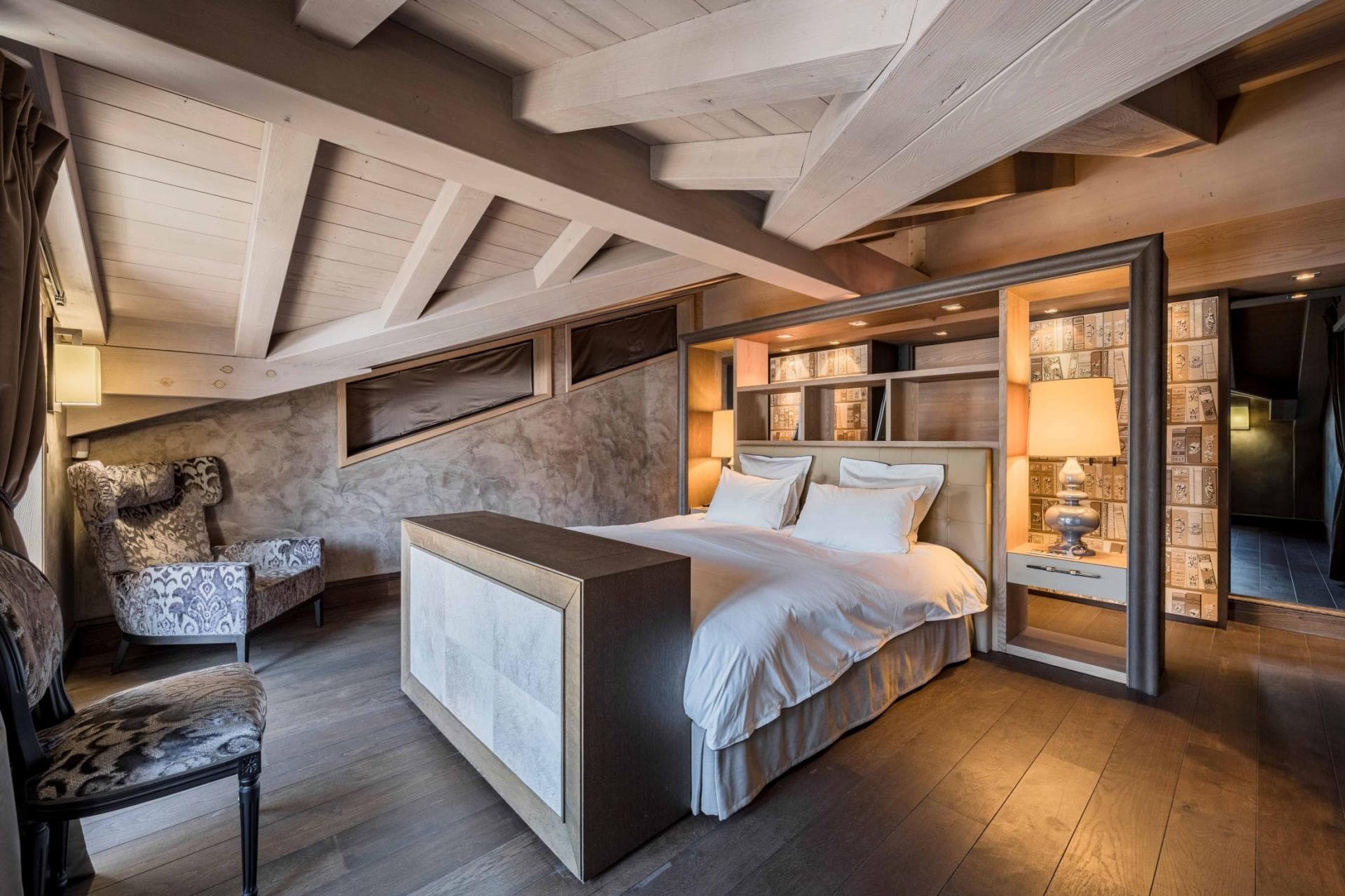 Attic bedroom with king bed and pop-up TV cabinet