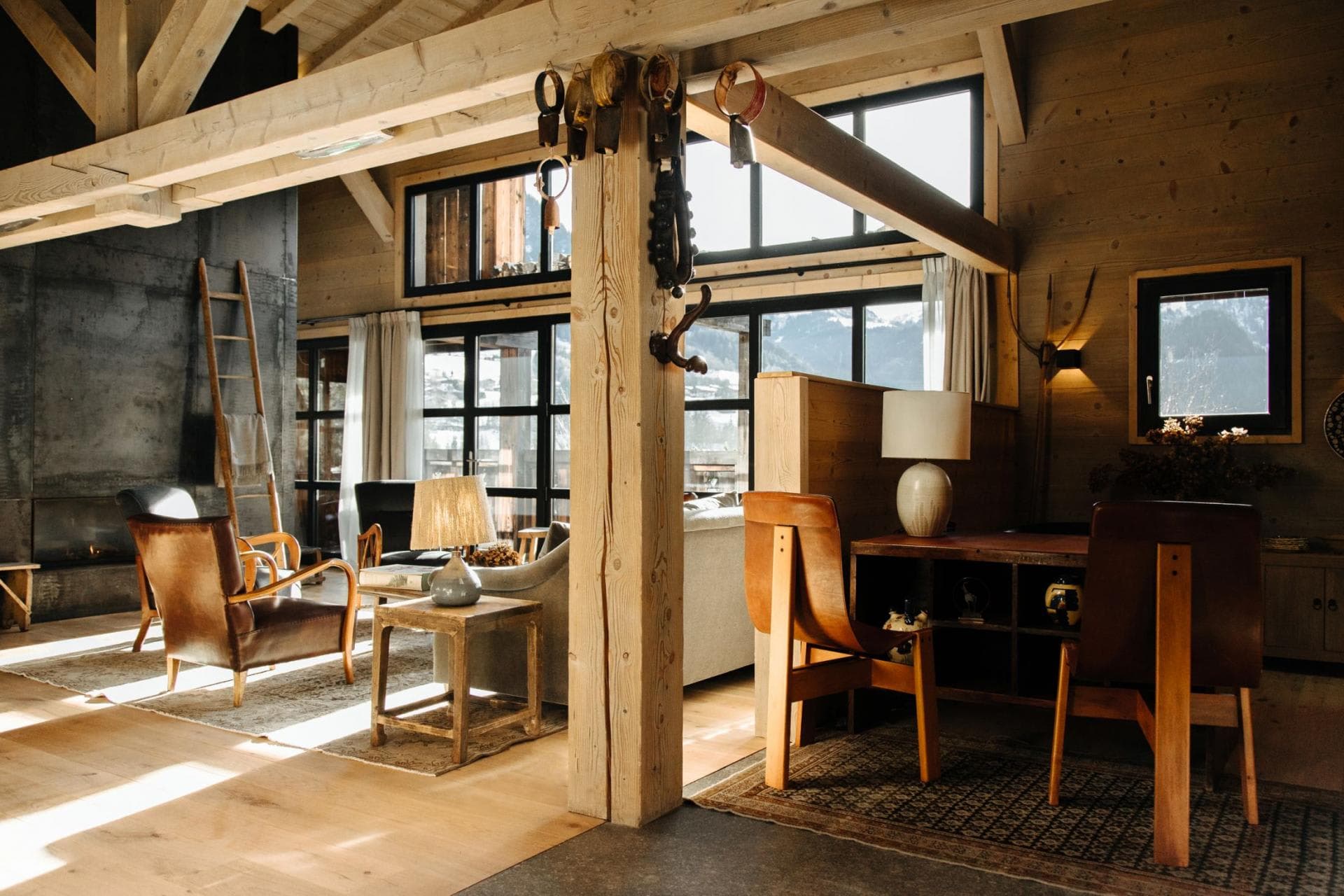 Open-plan living area with wood-burning fireplace and dedicated workspace