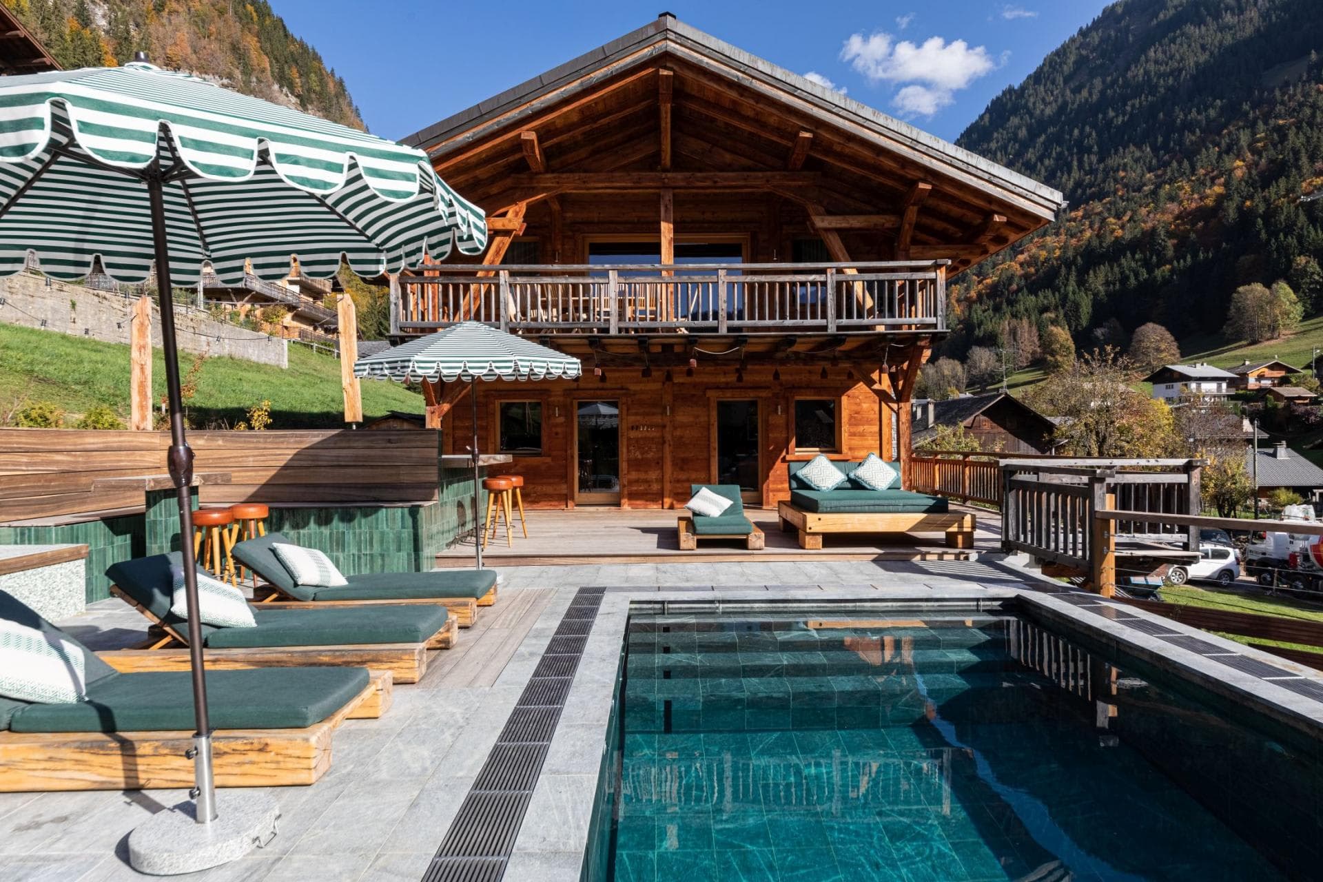 Outdoor heated pool and terrace with mountain valley views