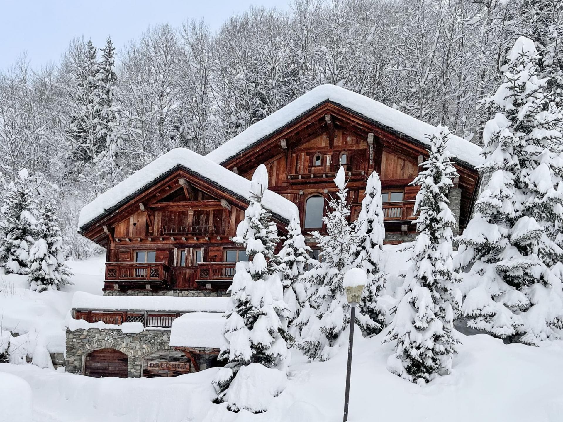 Ski-in chalet with timber facade and heated two-car garage