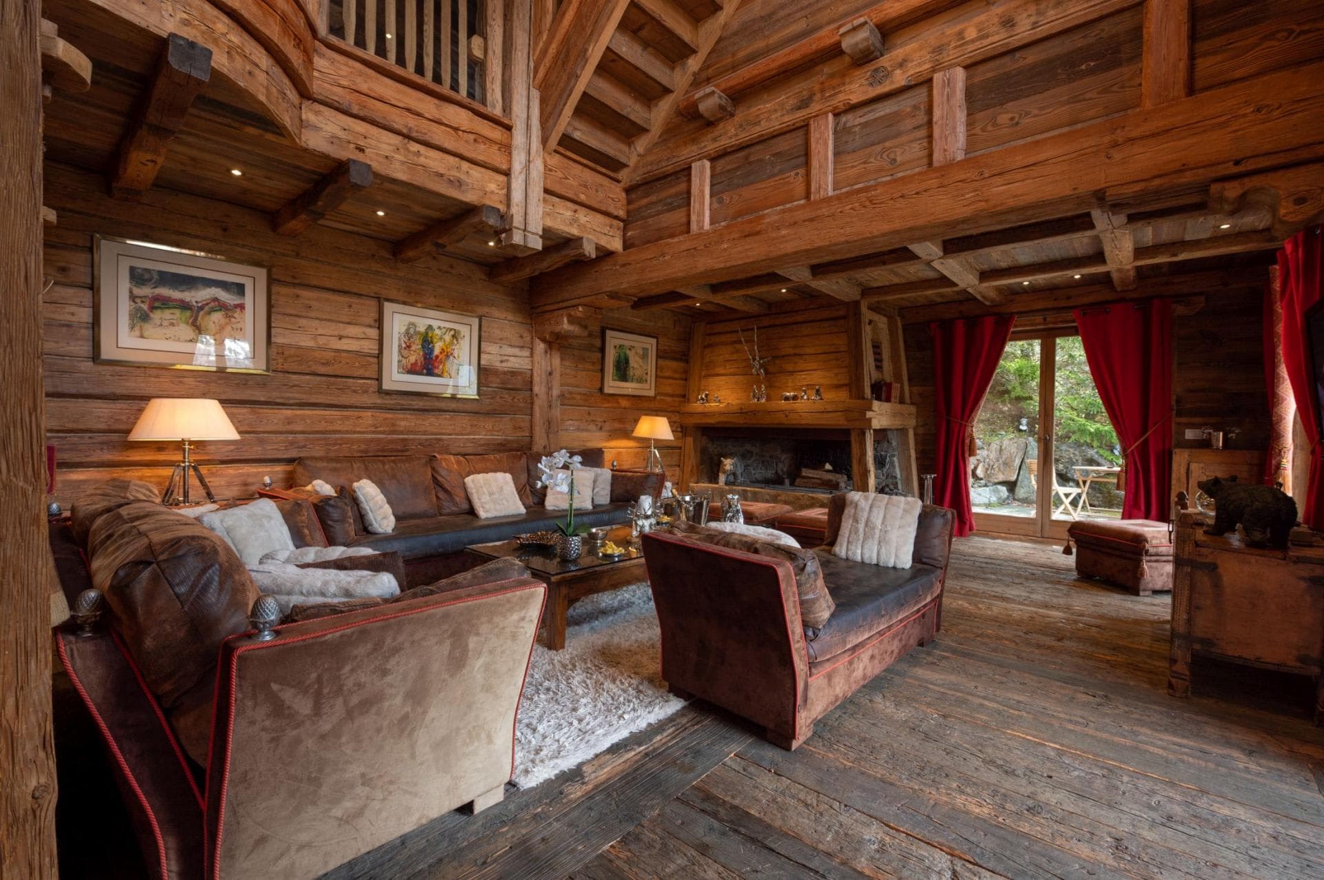 Living area with wood-burning fireplace and terrace access