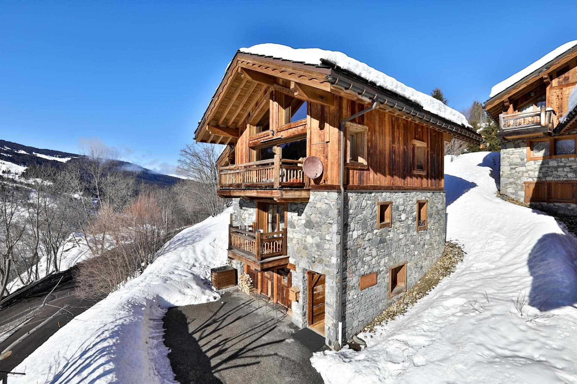 Ski-in chalet with private balconies and dedicated driveway parking