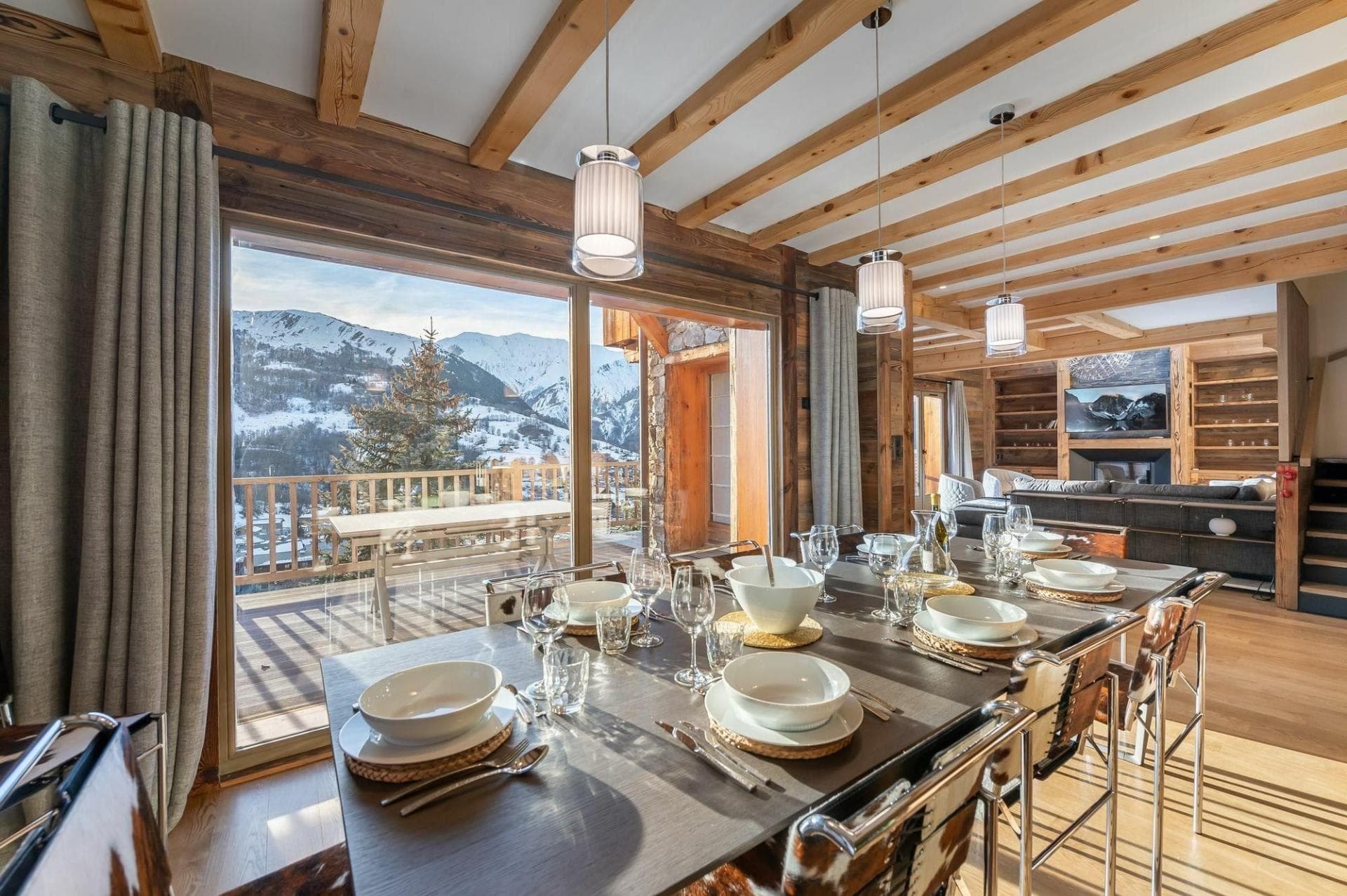Dining area with seating for 8 and mountain views via balcony access