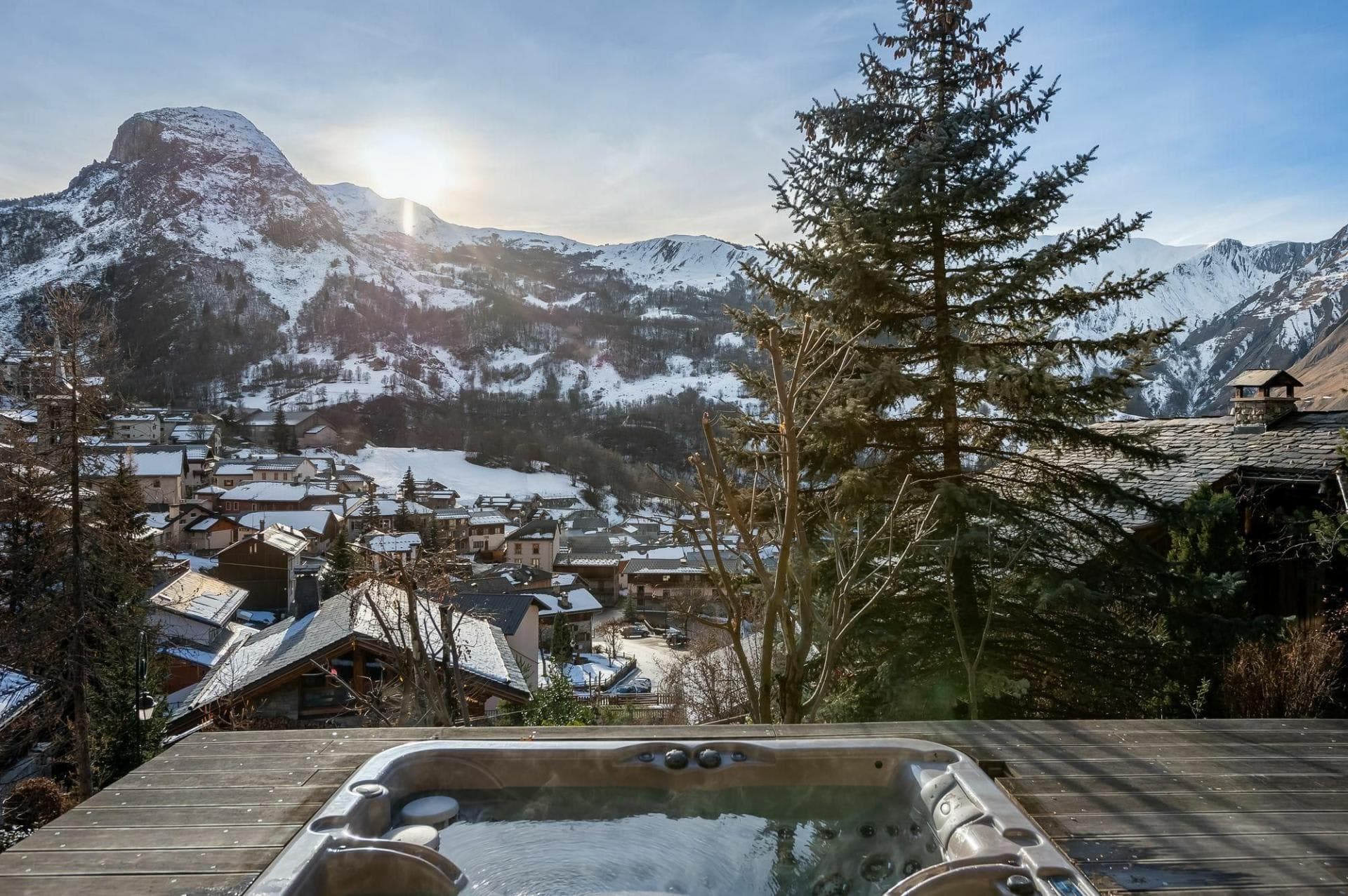 Deck hot tub with views of village and snow-capped mountains