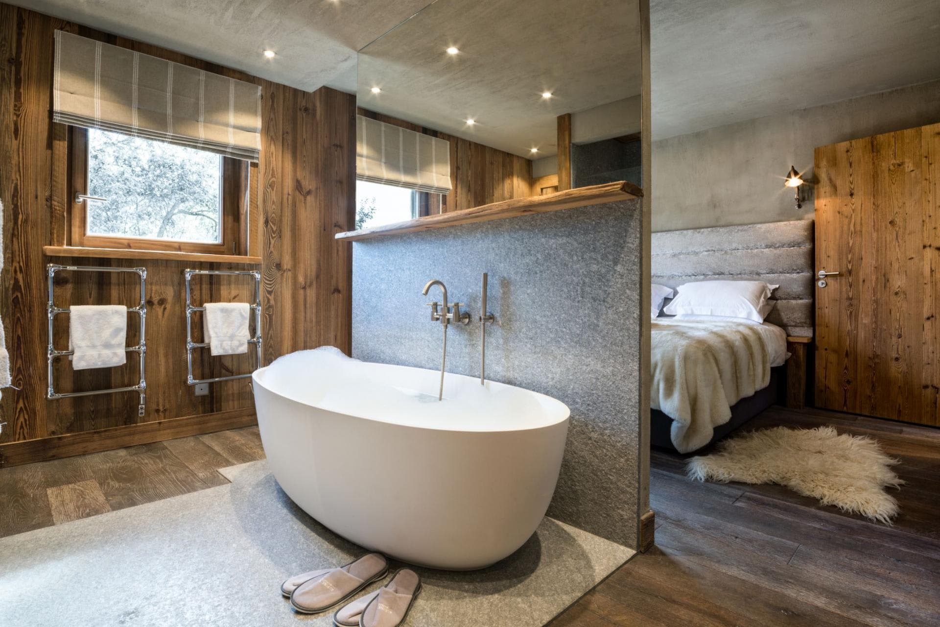 En suite bathroom with freestanding tub and heated towel rails