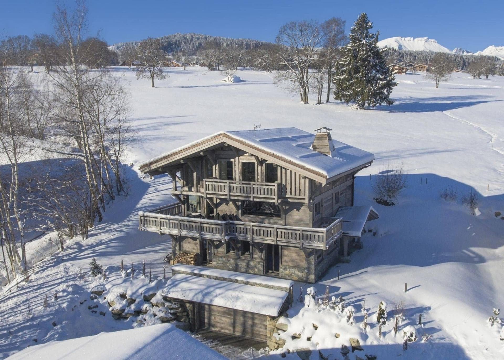 Ski-in chalet with wrap-around balconies and private garage parking