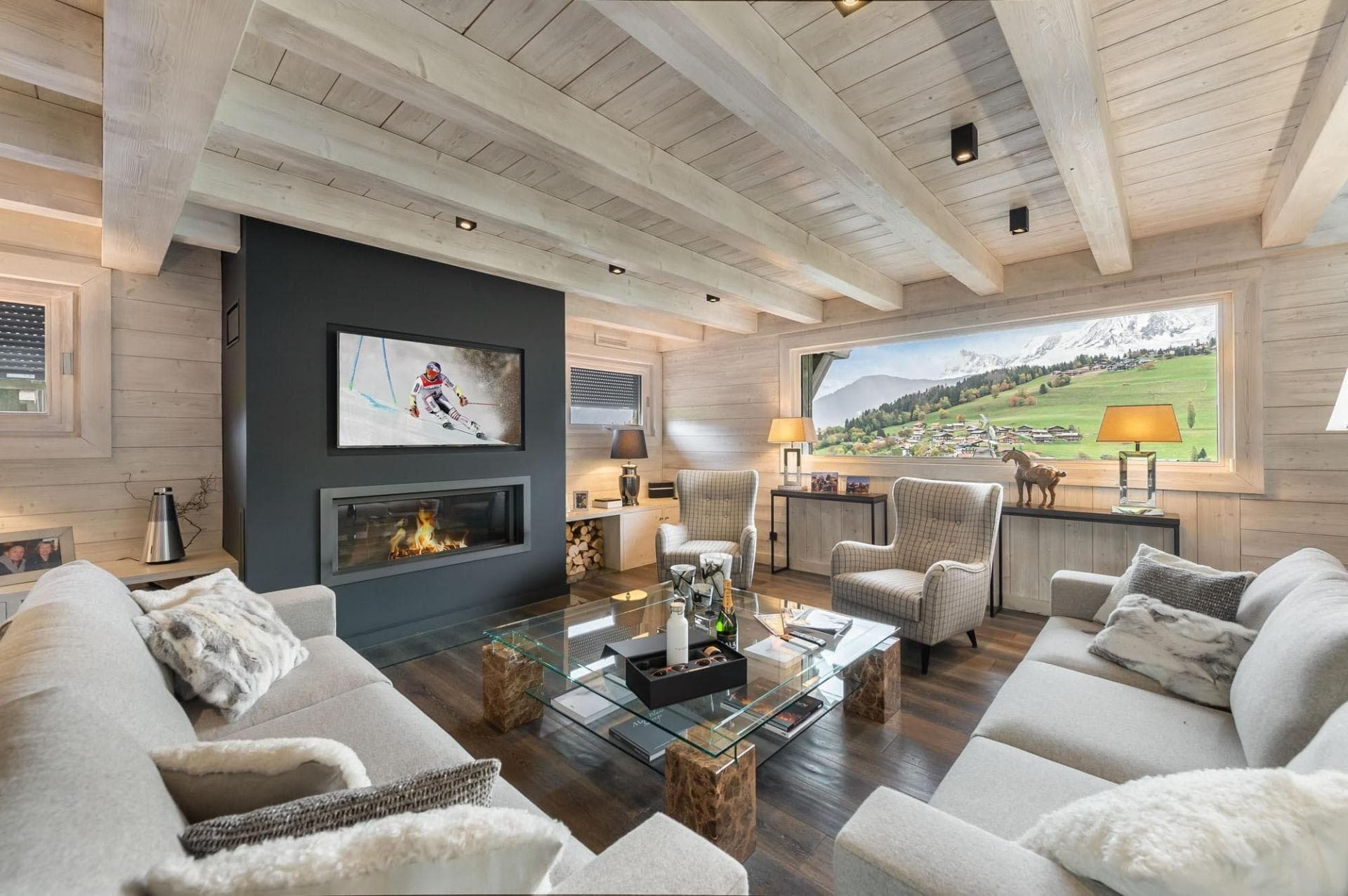 Living area with wood-burning fireplace and mountain valley views