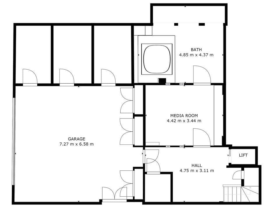 Lower level floor plan: garage, media room, lift access, and large bathroom