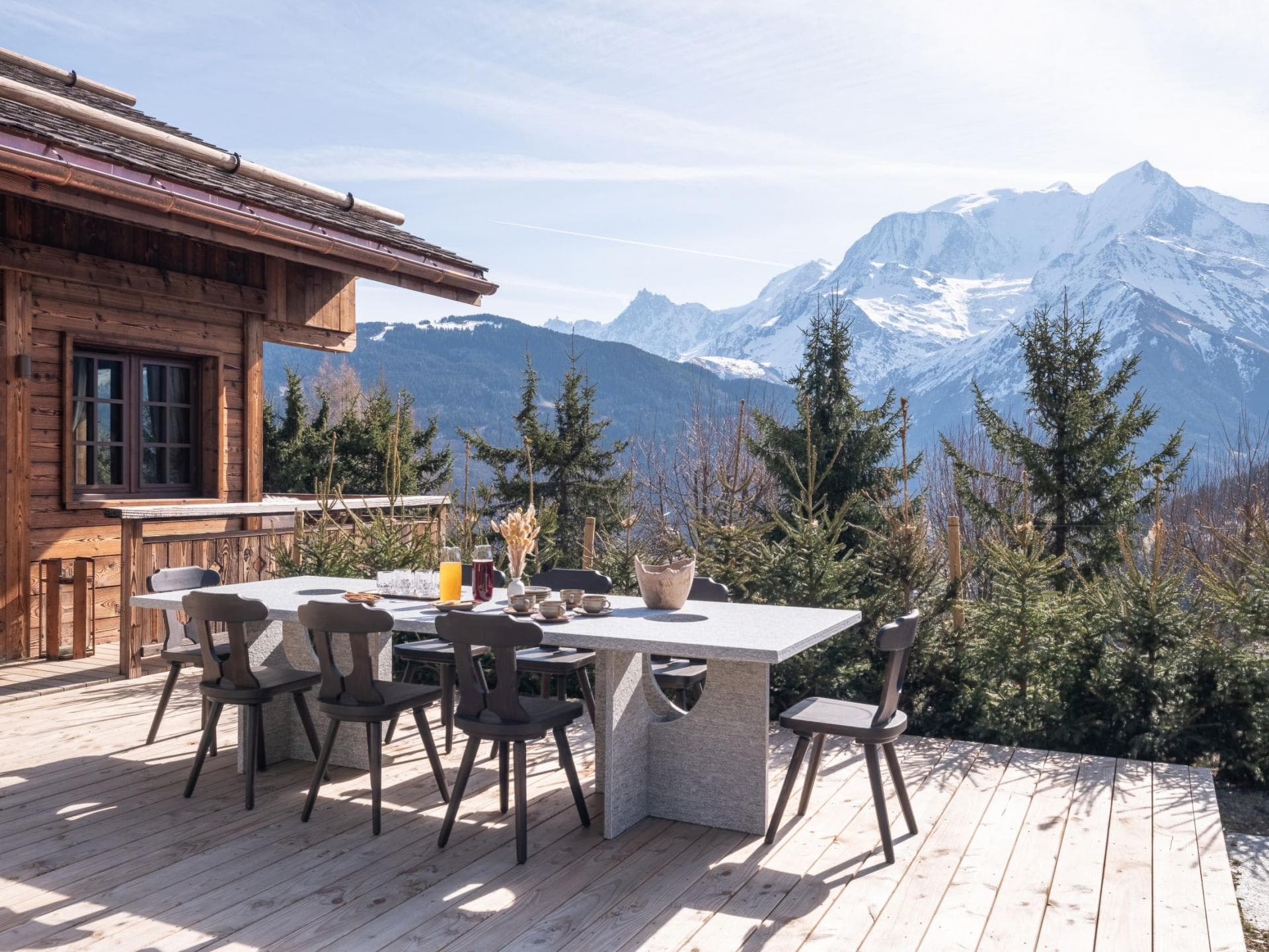 Outdoor dining area seats 8; panoramic snow-capped mountain views