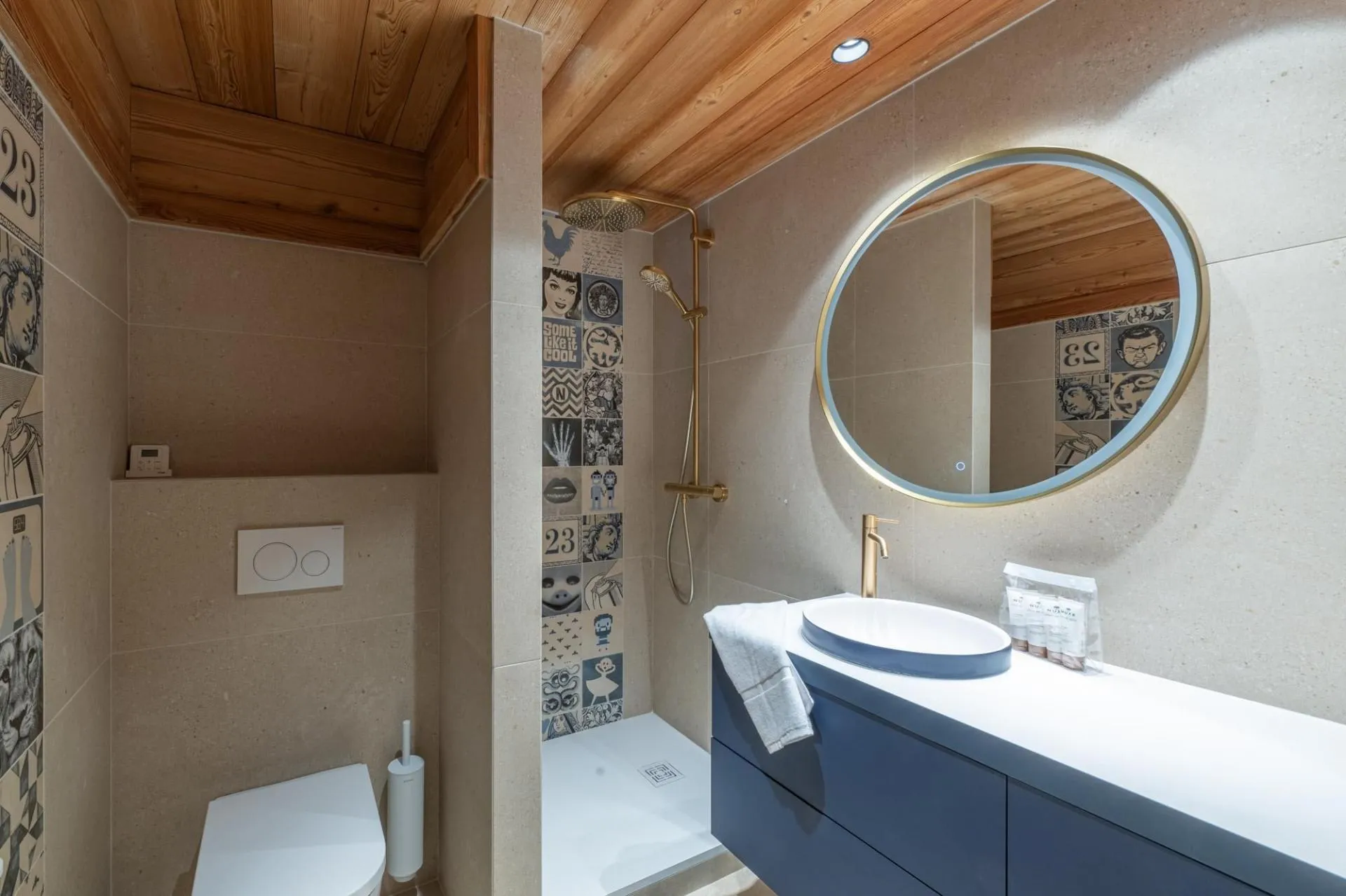 En-suite shower room with walk-in shower and illuminated mirror