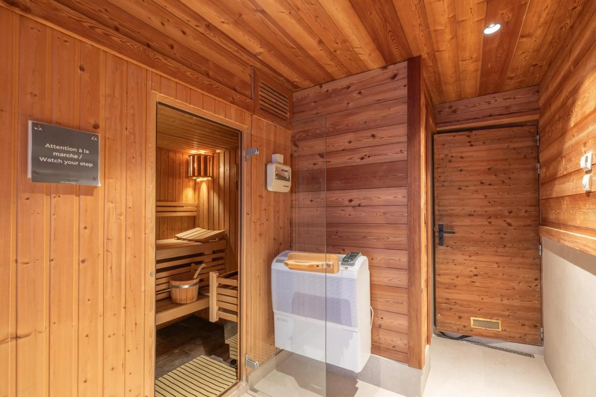 Private sauna with tiered timber bench seating