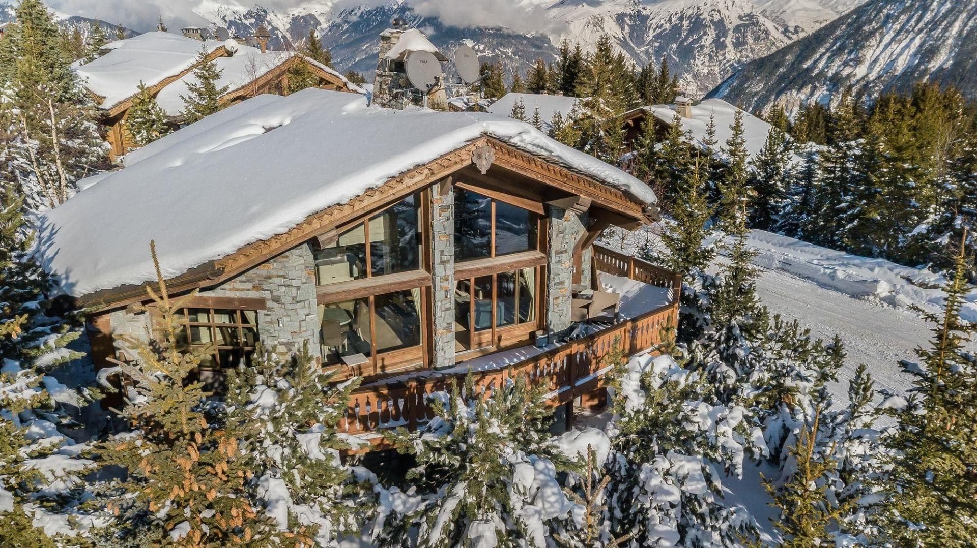 Ski-in, ski-out chalet with wrap-around balcony and valley views