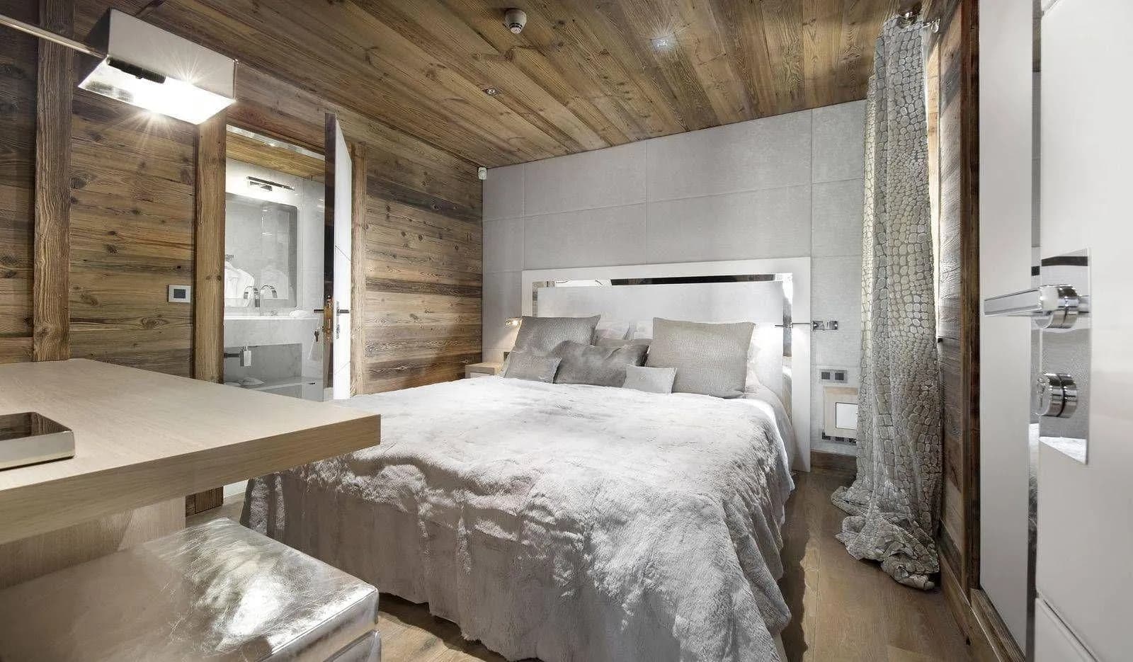 Double bedroom with timber walls and basin beside the bed