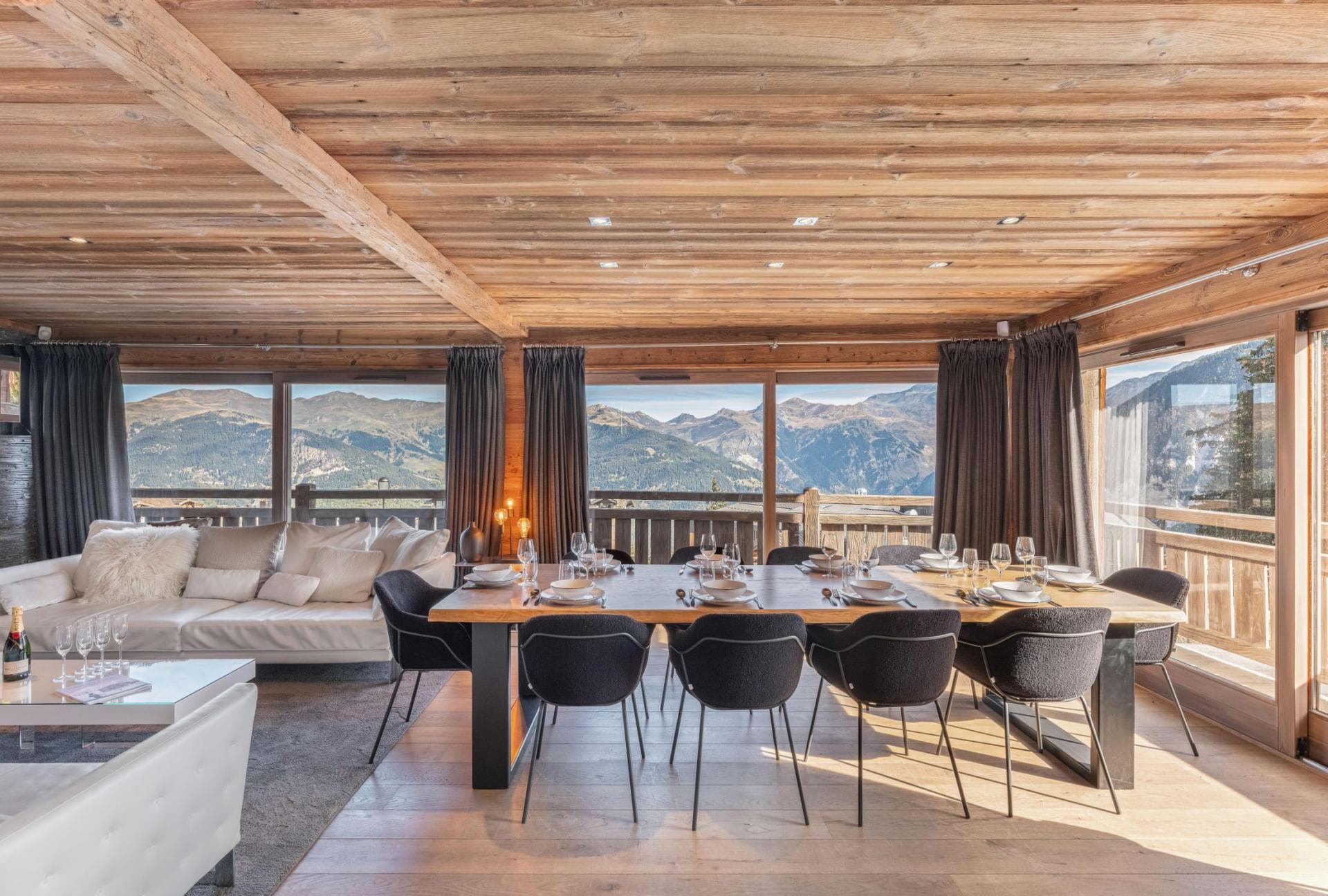 Open-plan dining area with seating for 10 and panoramic mountain views