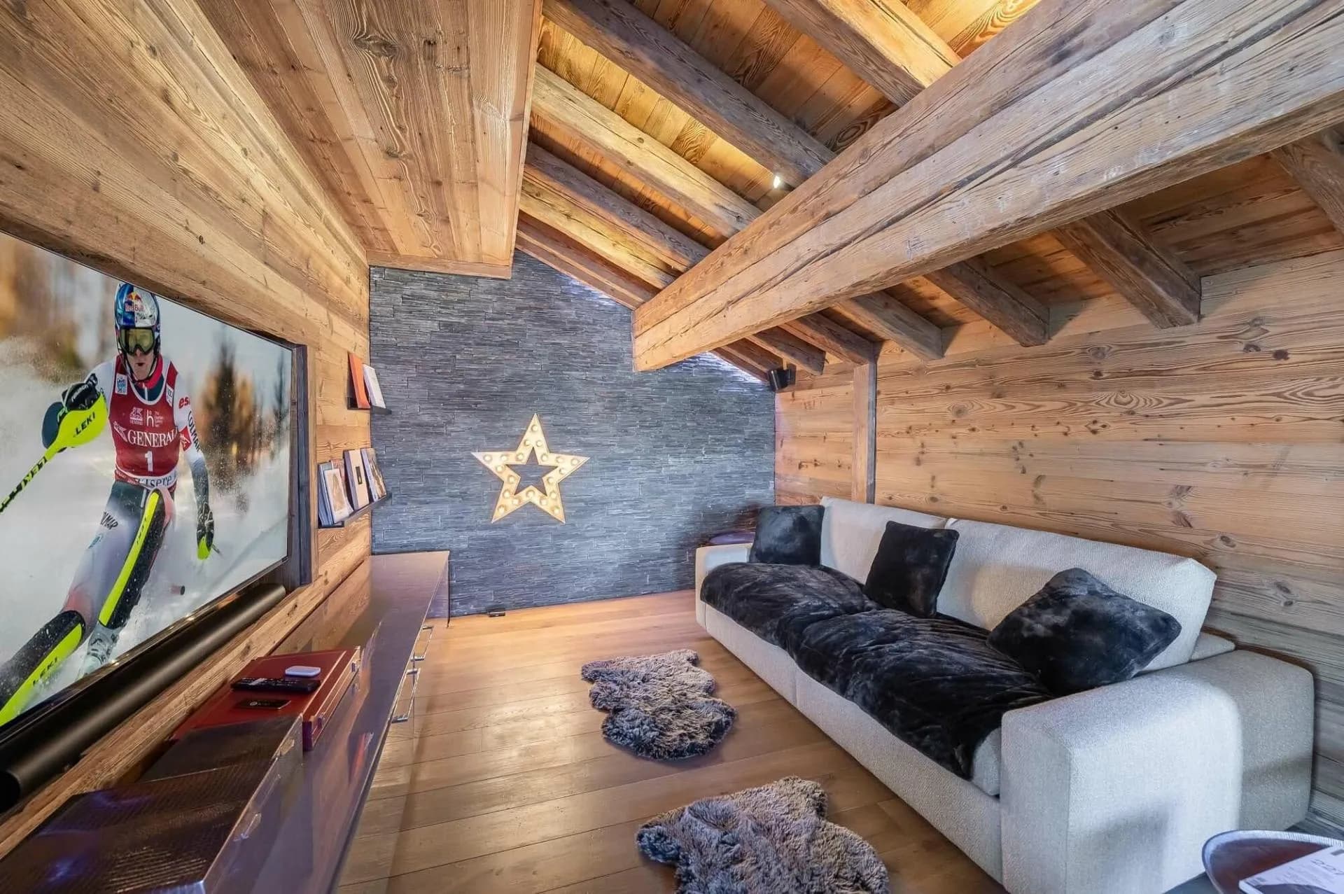 Timber-lined TV lounge with upholstered sofa