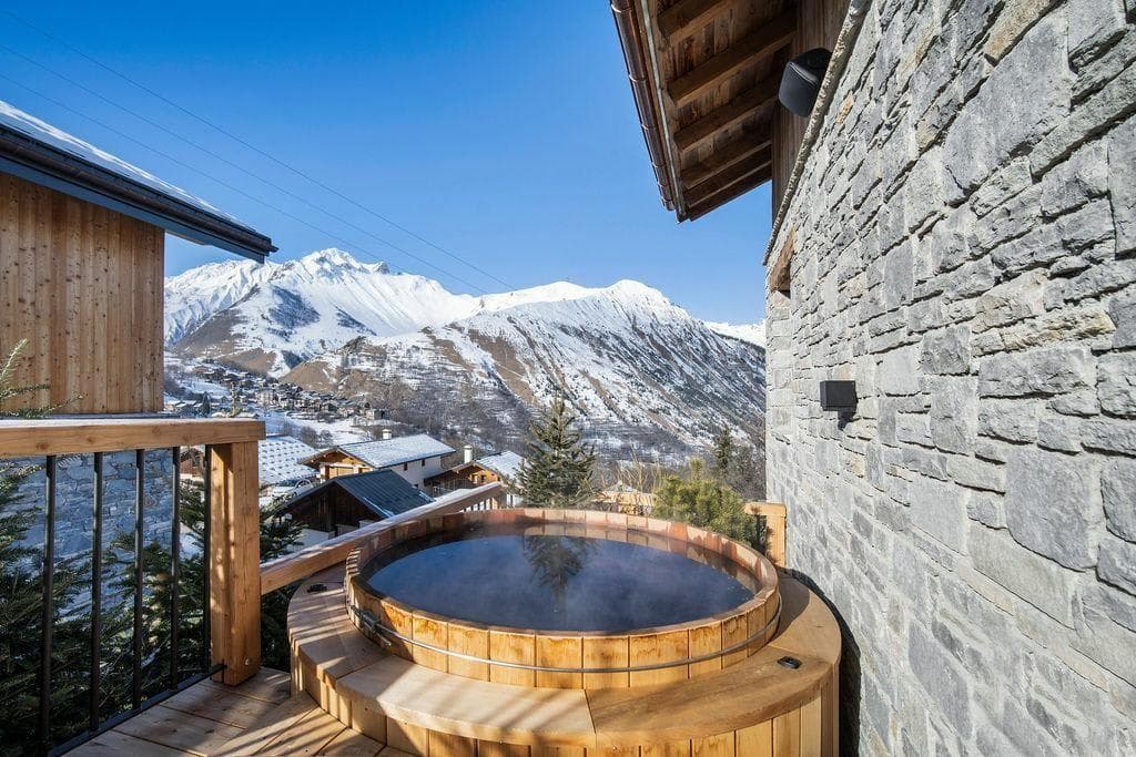 Cedar hot tub on private deck with Alpine mountain views