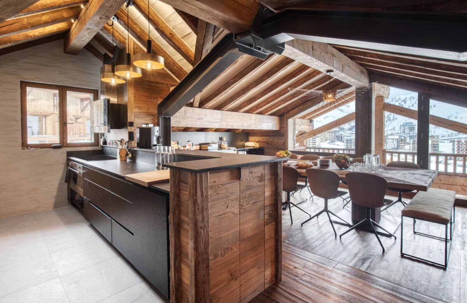 Open-plan kitchen and dining area with mountain views and breakfast bar