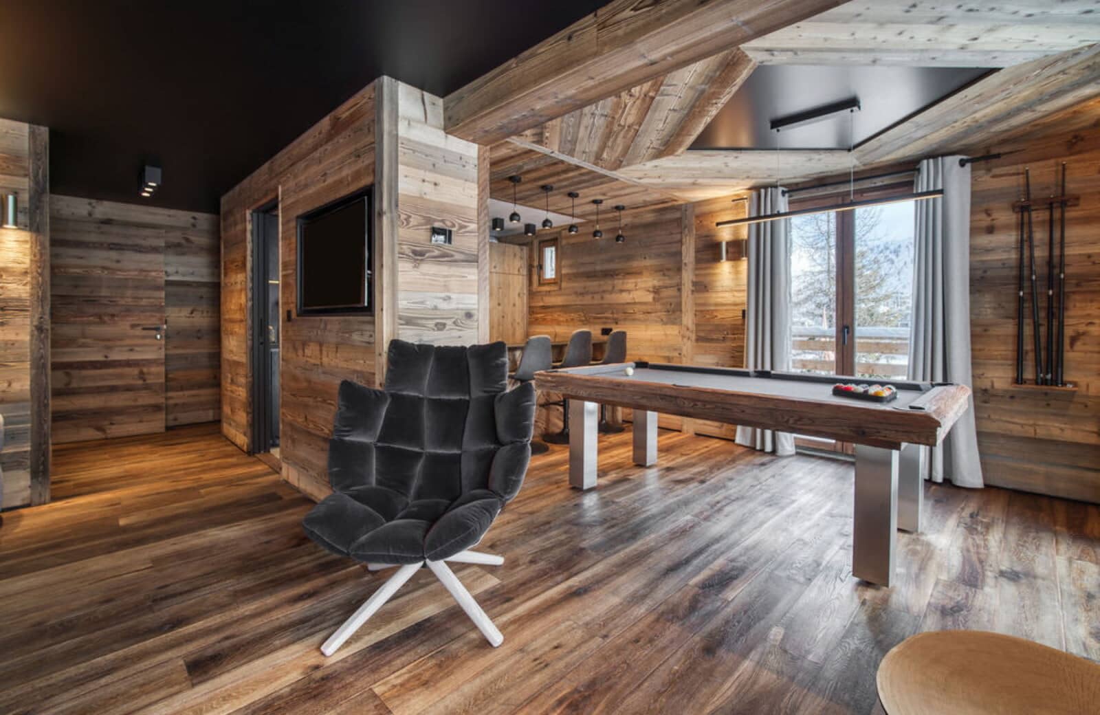 Game room with regulation-size pool table and bar seating