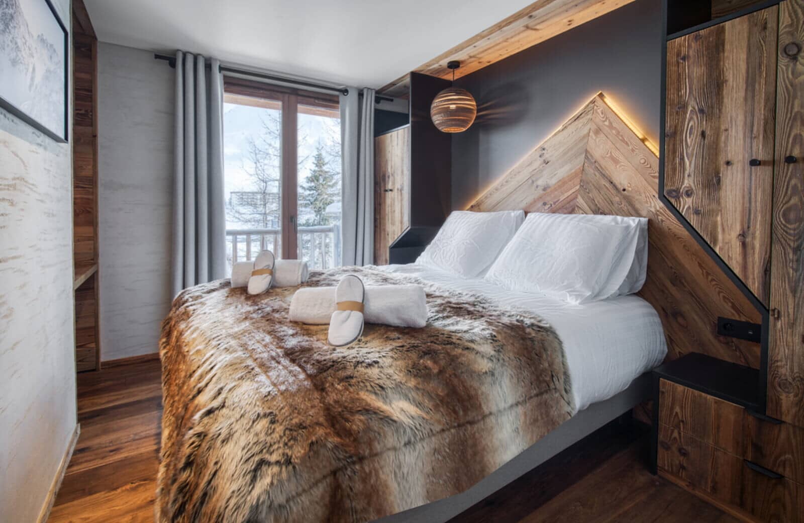 Guest bedroom with queen bed and integrated wood storage cabinets