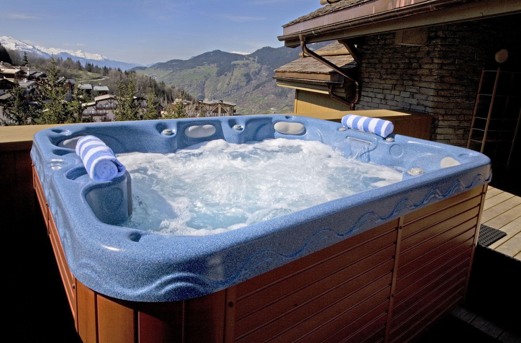 Outdoor hot tub with panoramic mountain and valley views