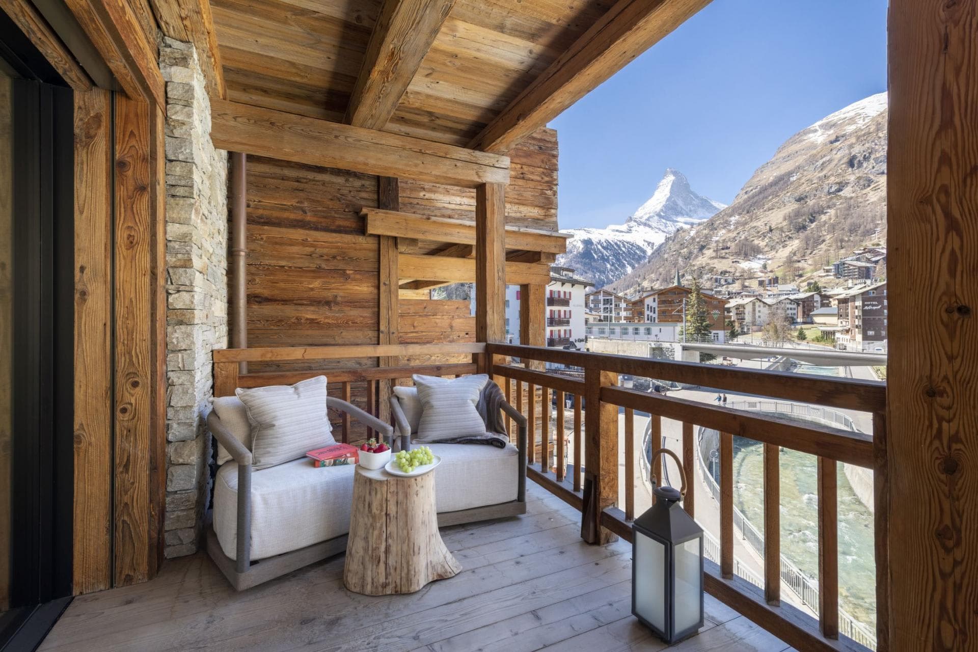 Covered balcony with Matterhorn views and lounge seating for two