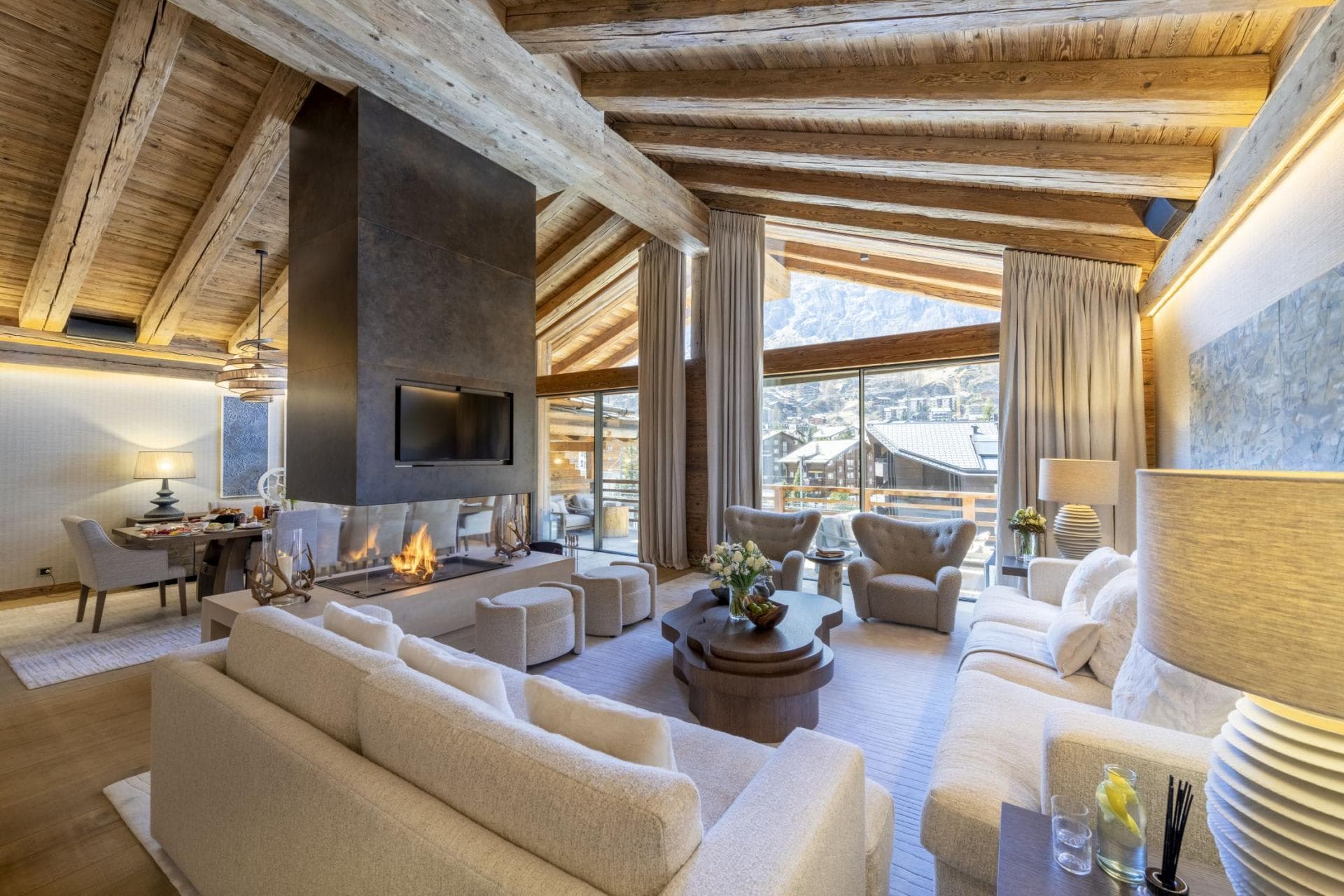 Open living area with double-sided gas fireplace and mountain views