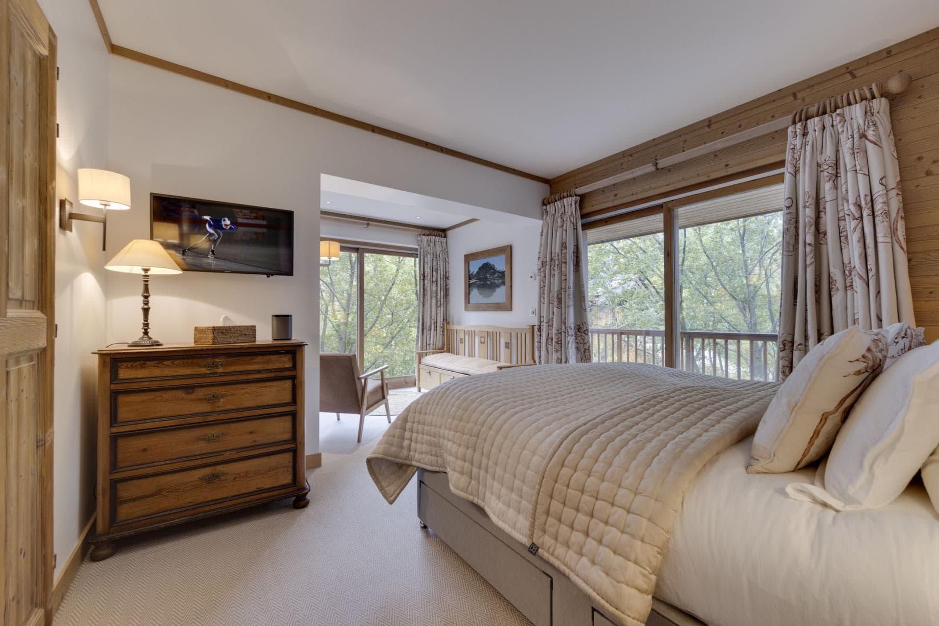 King bedroom with reading nook and private balcony access