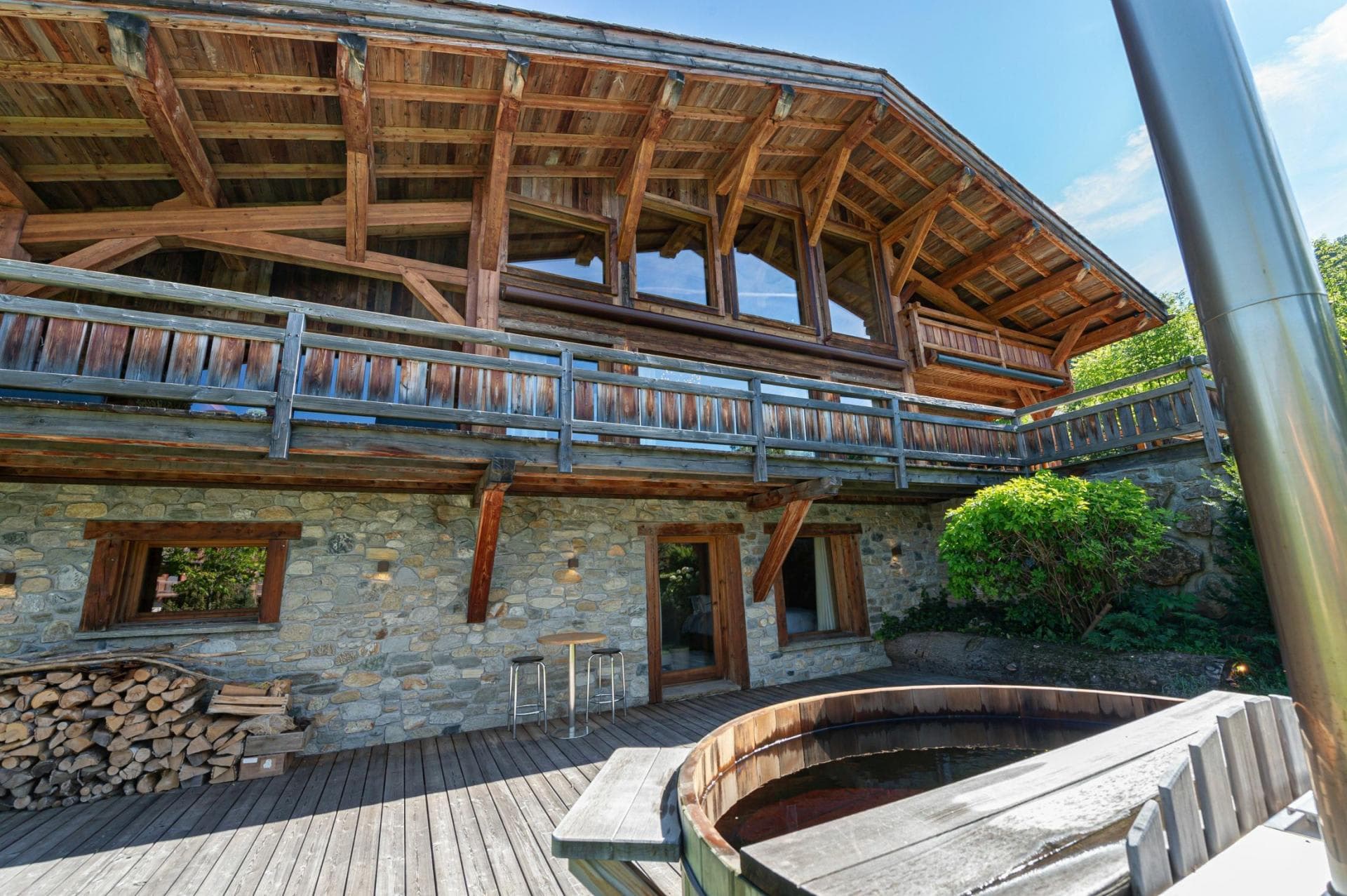 Lower deck with wood-fired hot tub and bistro seating