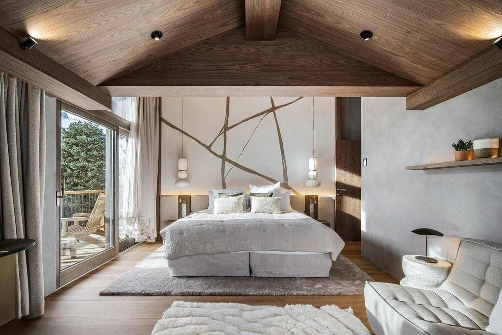 Primary bedroom with king bed and private balcony access