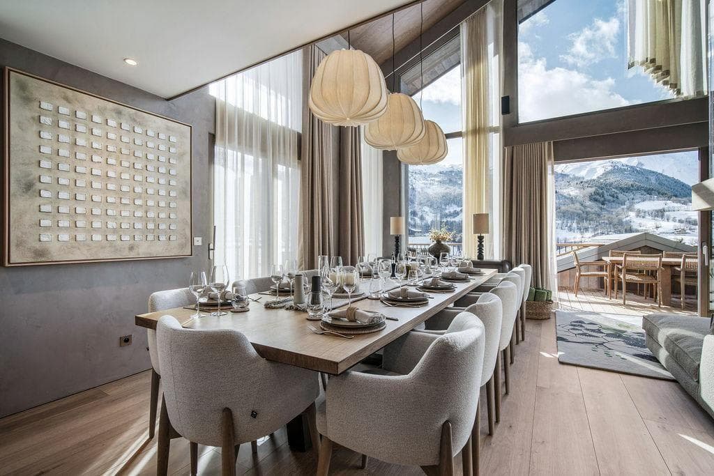 Dining area seats 10; floor-to-ceiling mountain views and terrace access