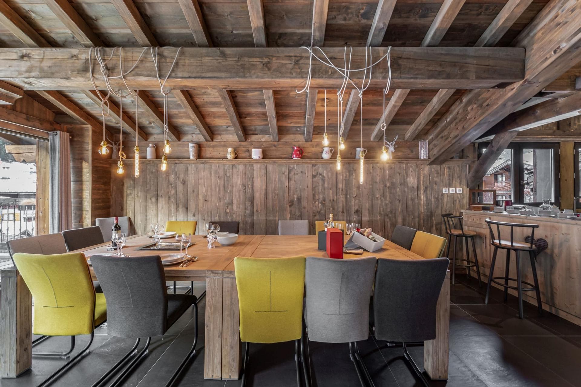 Dining area seats 10; adjacent breakfast bar with stool seating