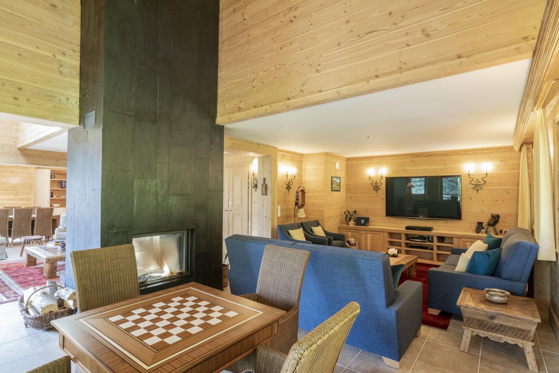 Living area with slate fireplace and built-in chessboard table