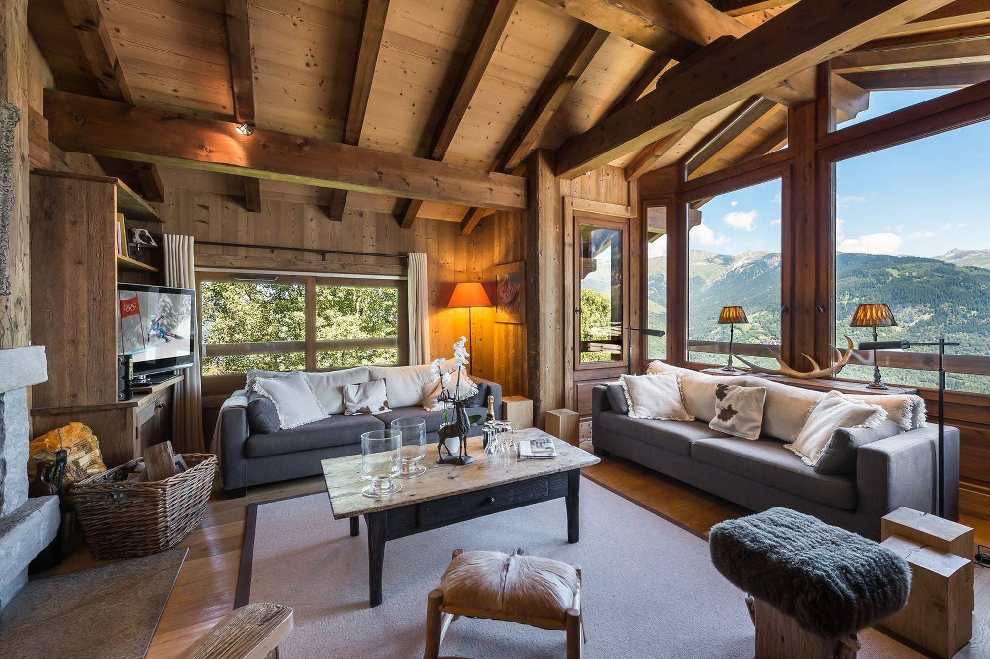 Living room with timber beams and panoramic valley views